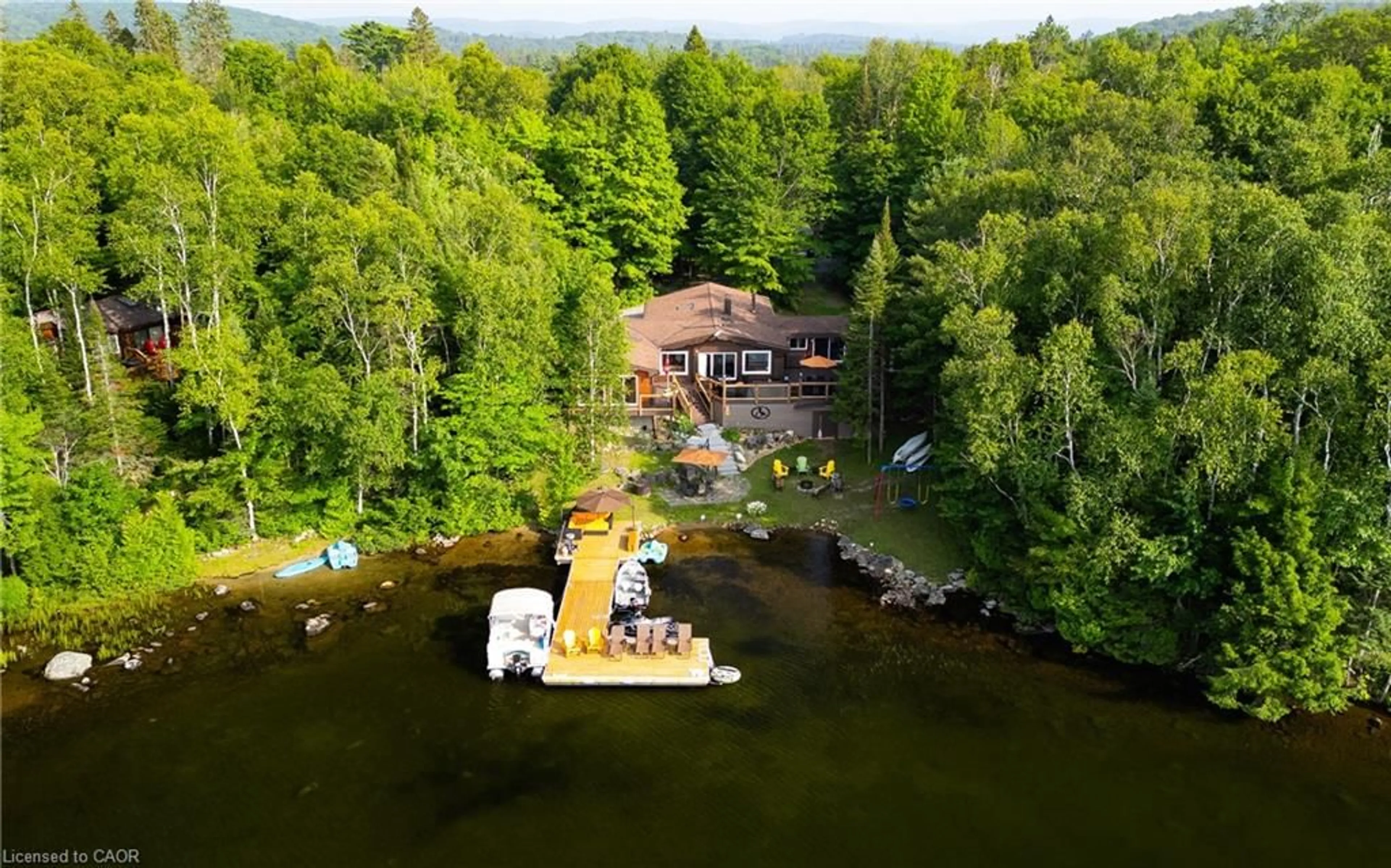 A pic from outside/outdoor area/front of a property/back of a property/a pic from drone, water/lake/river/ocean view for 57 Lake Haven Dr, Kearney Ontario P0A 1Z0