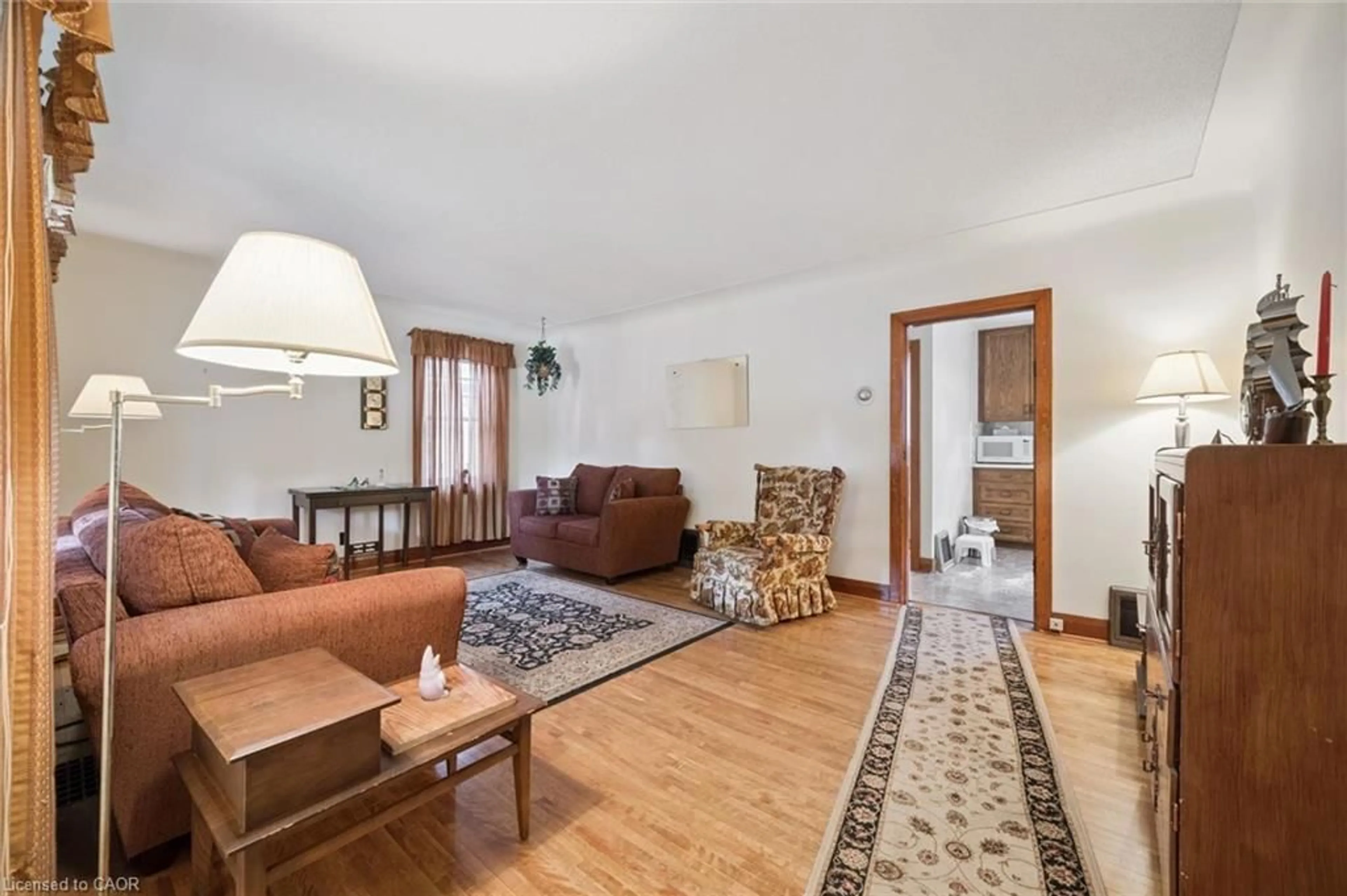 Living room with furniture, wood/laminate floor for 75 Arnold St, Kitchener Ontario N2H 6C9