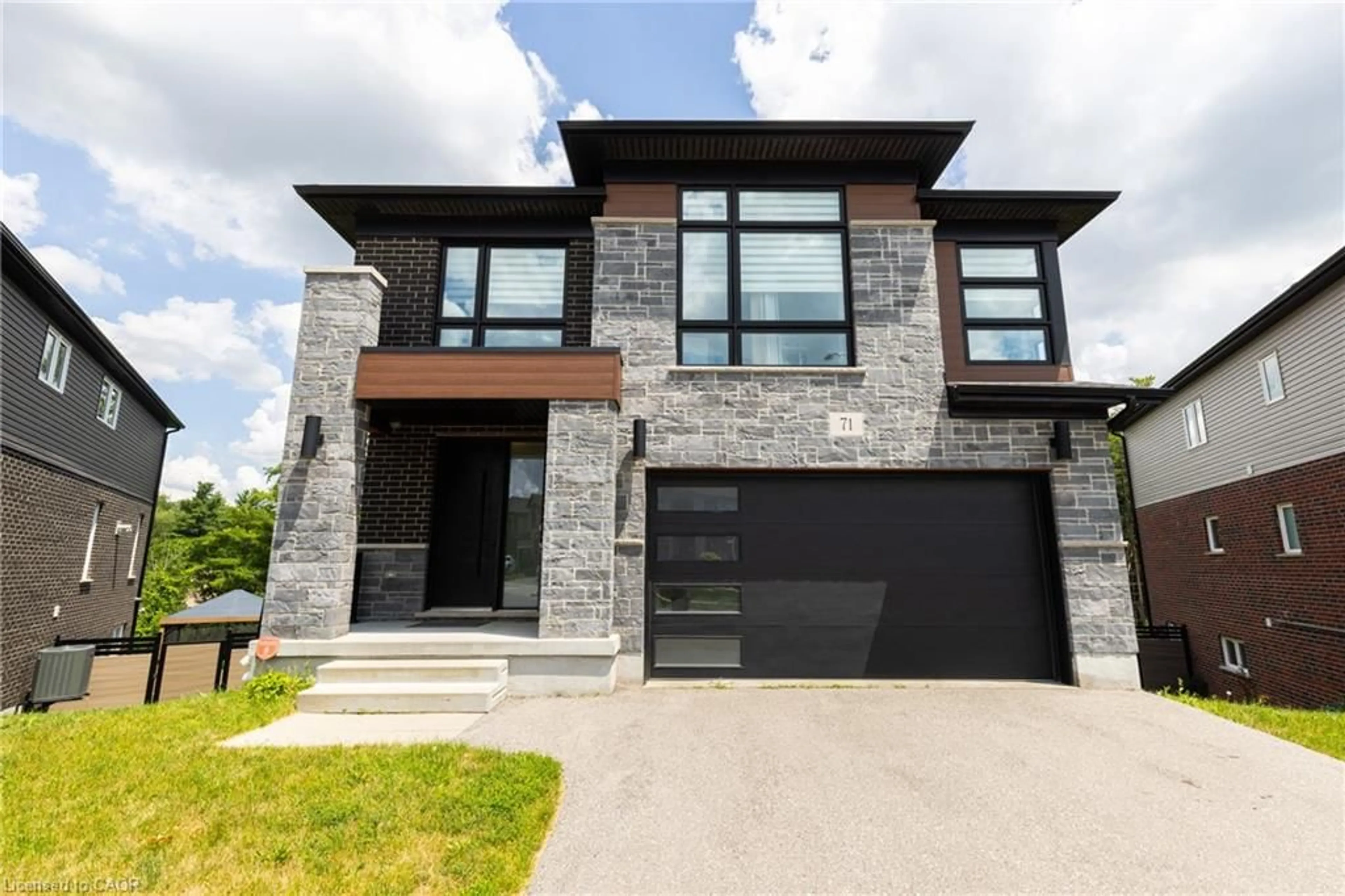 Home with brick exterior material, street for 71 Ian Ormston Dr, Waterloo Ontario N2P 2J6