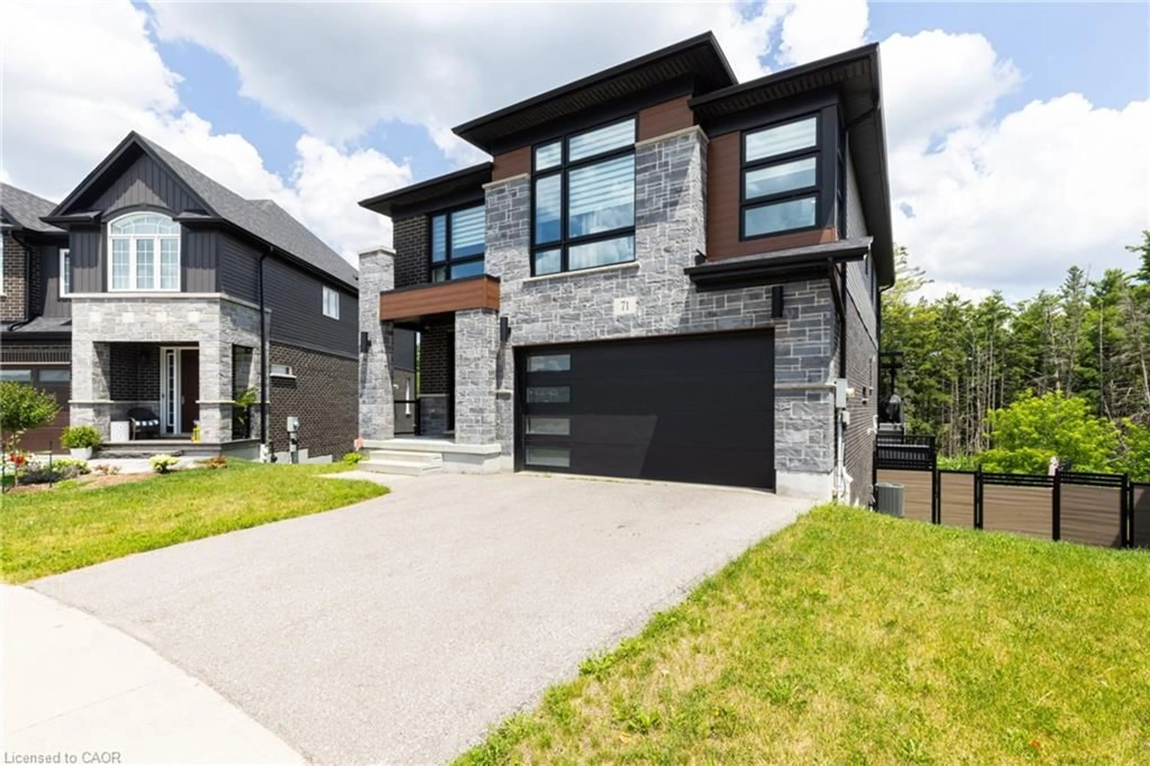 Home with brick exterior material, street for 71 Ian Ormston Dr, Waterloo Ontario N2P 2J6