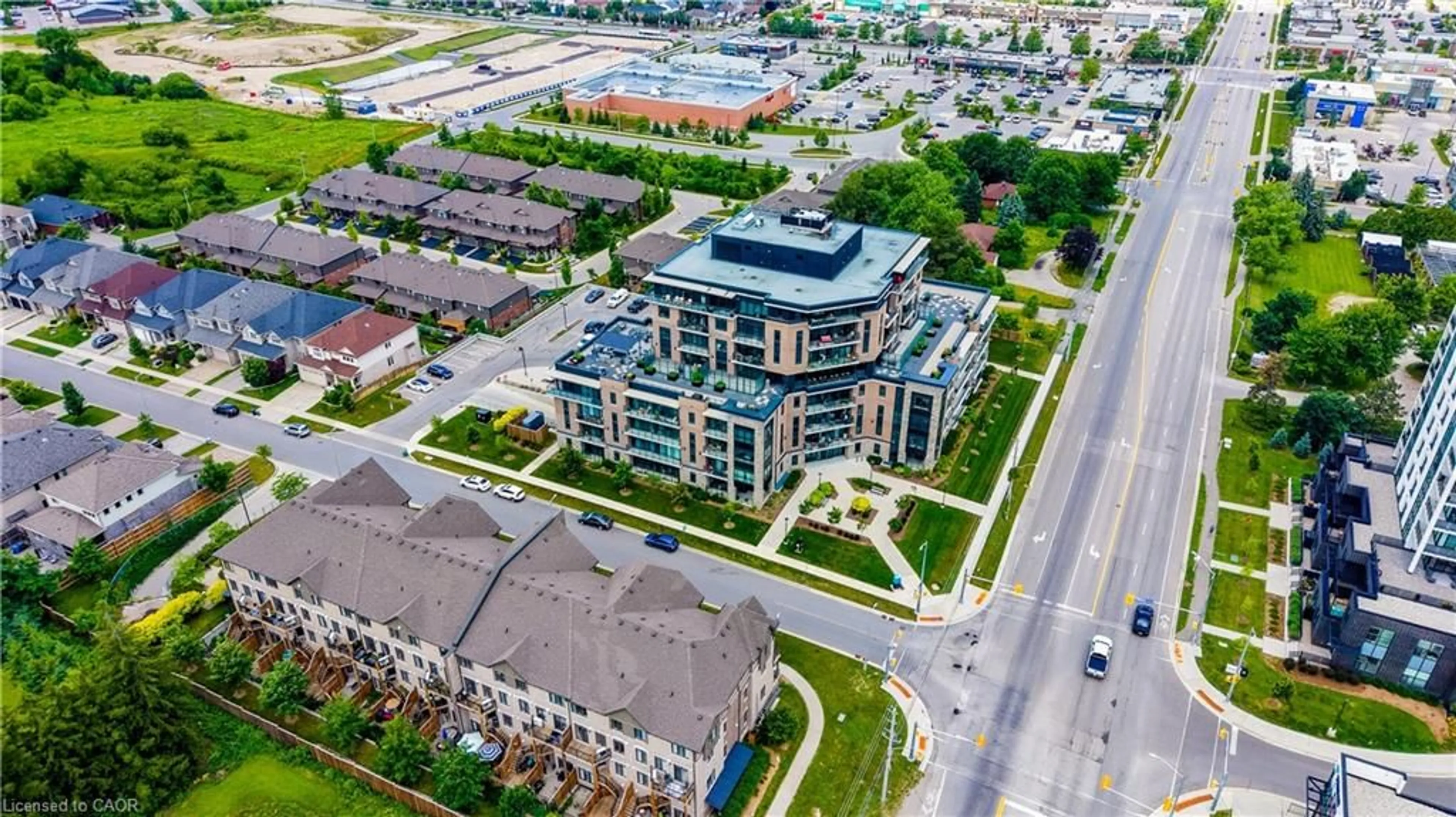 A pic from outside/outdoor area/front of a property/back of a property/a pic from drone, unknown for 332 Gosling Gdns #104, Guelph Ontario N1L 0P8