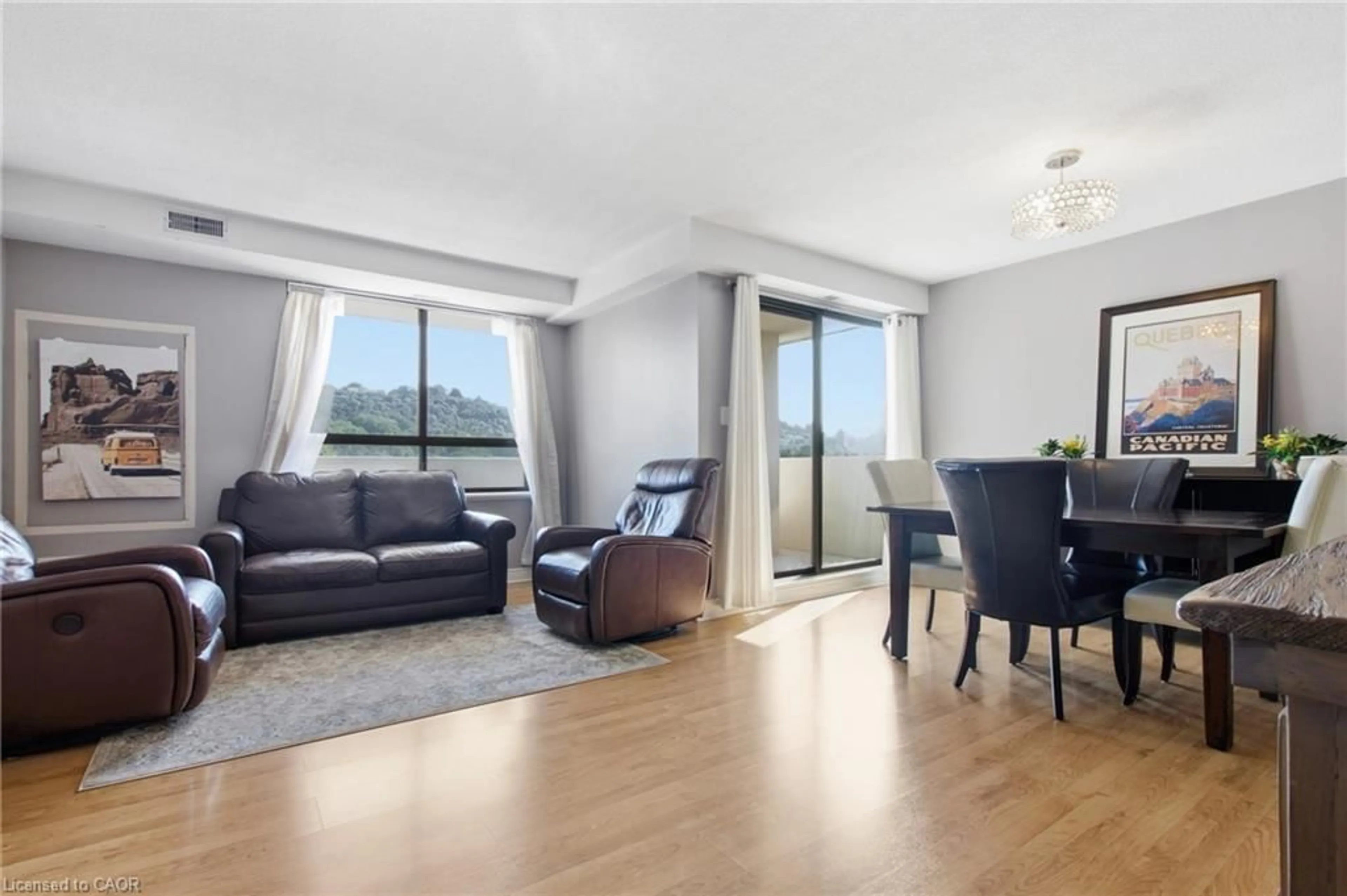 Living room with furniture, wood/laminate floor for 432 Main St #801, Hamilton Ontario L8N 1J9