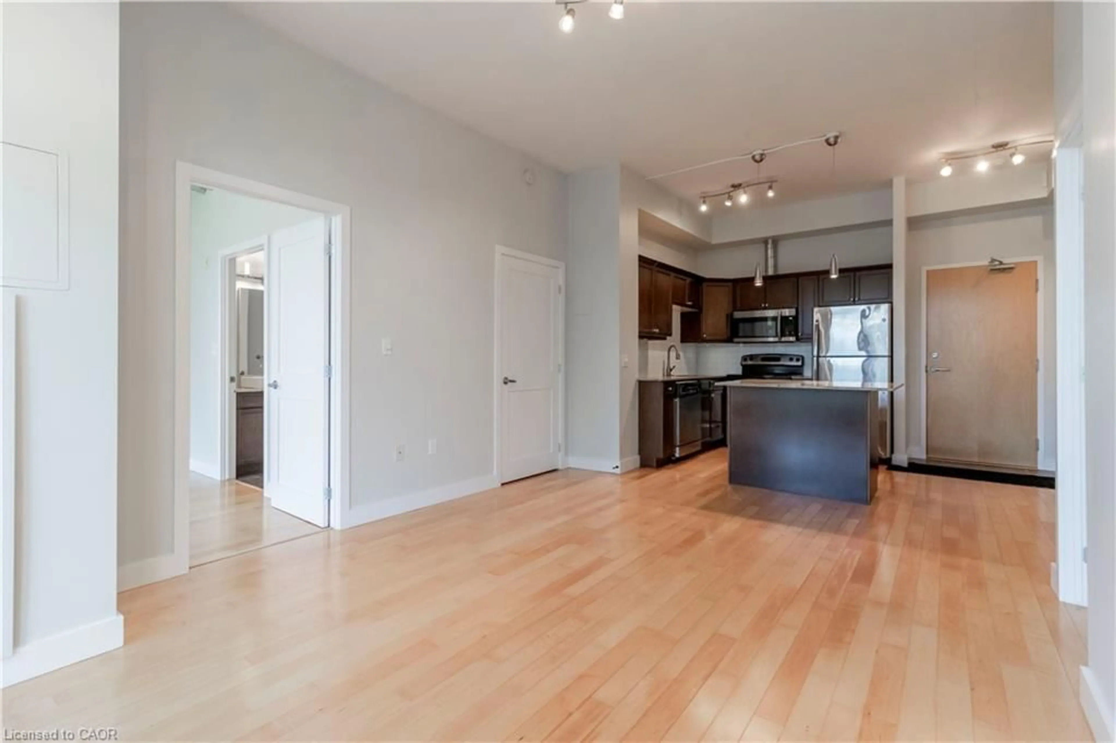 Open concept kitchen, wood/laminate floor for 42 Bridgeport Rd #301, Waterloo Ontario N2J 0B3