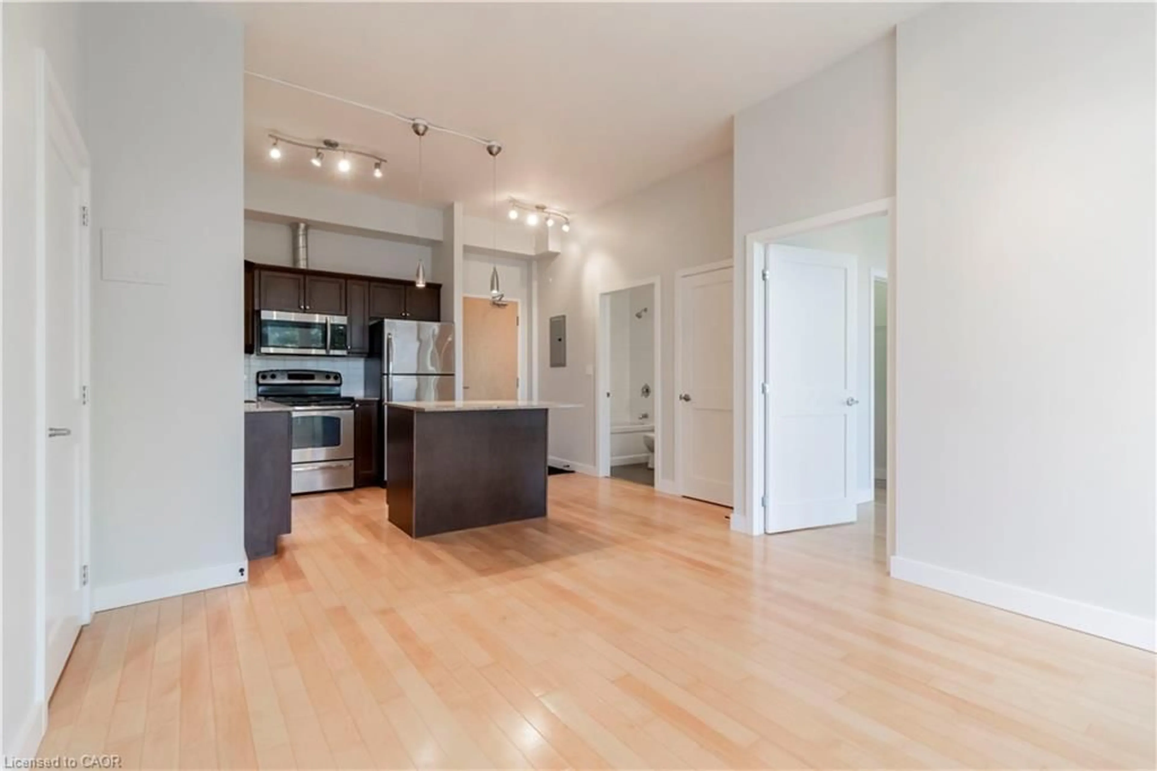 Open concept kitchen, wood/laminate floor for 42 Bridgeport Rd #301, Waterloo Ontario N2J 0B3