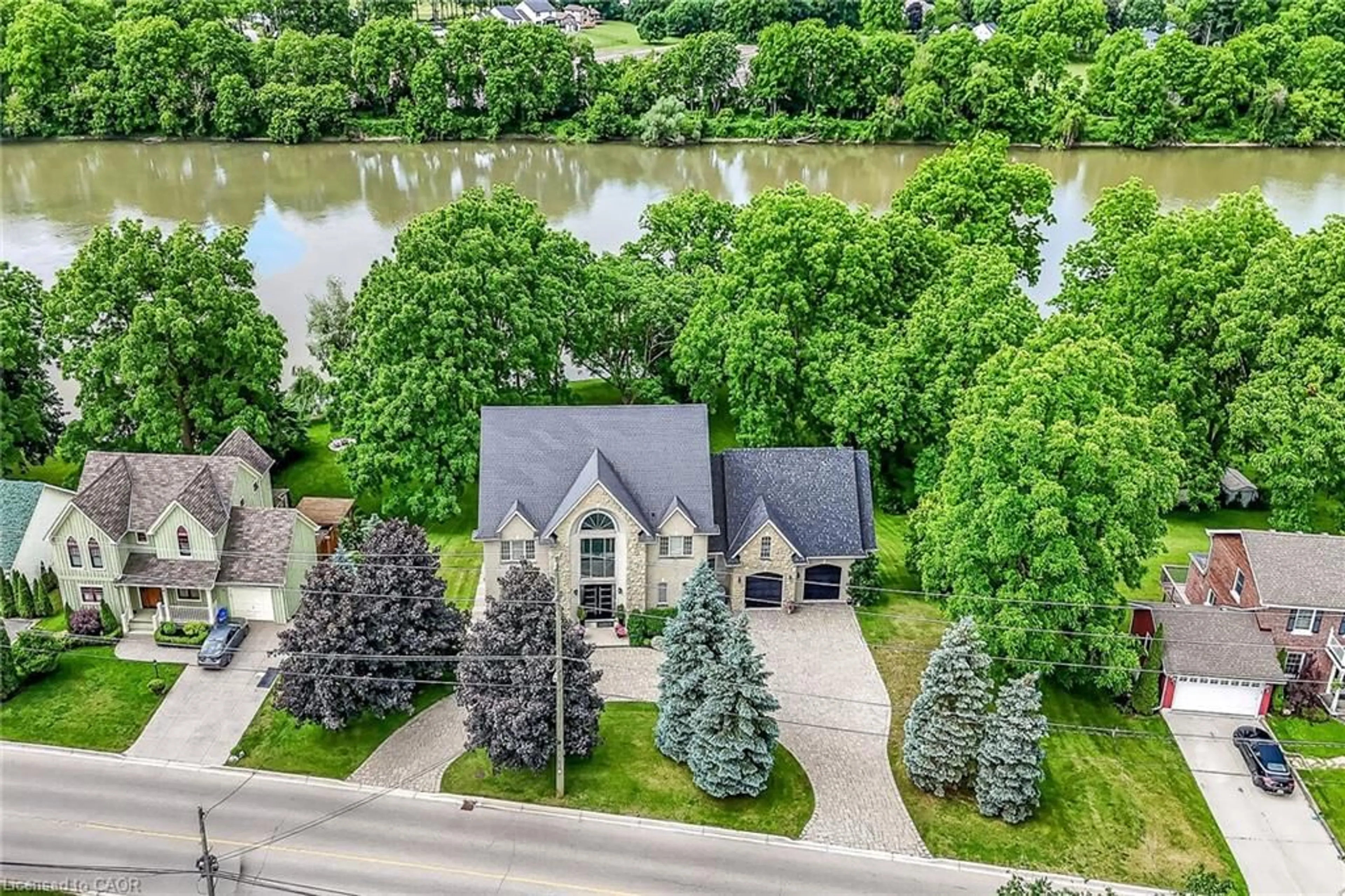 A pic from outside/outdoor area/front of a property/back of a property/a pic from drone, water/lake/river/ocean view for 397 Caithness St, Caledonia Ontario N3W 1C8