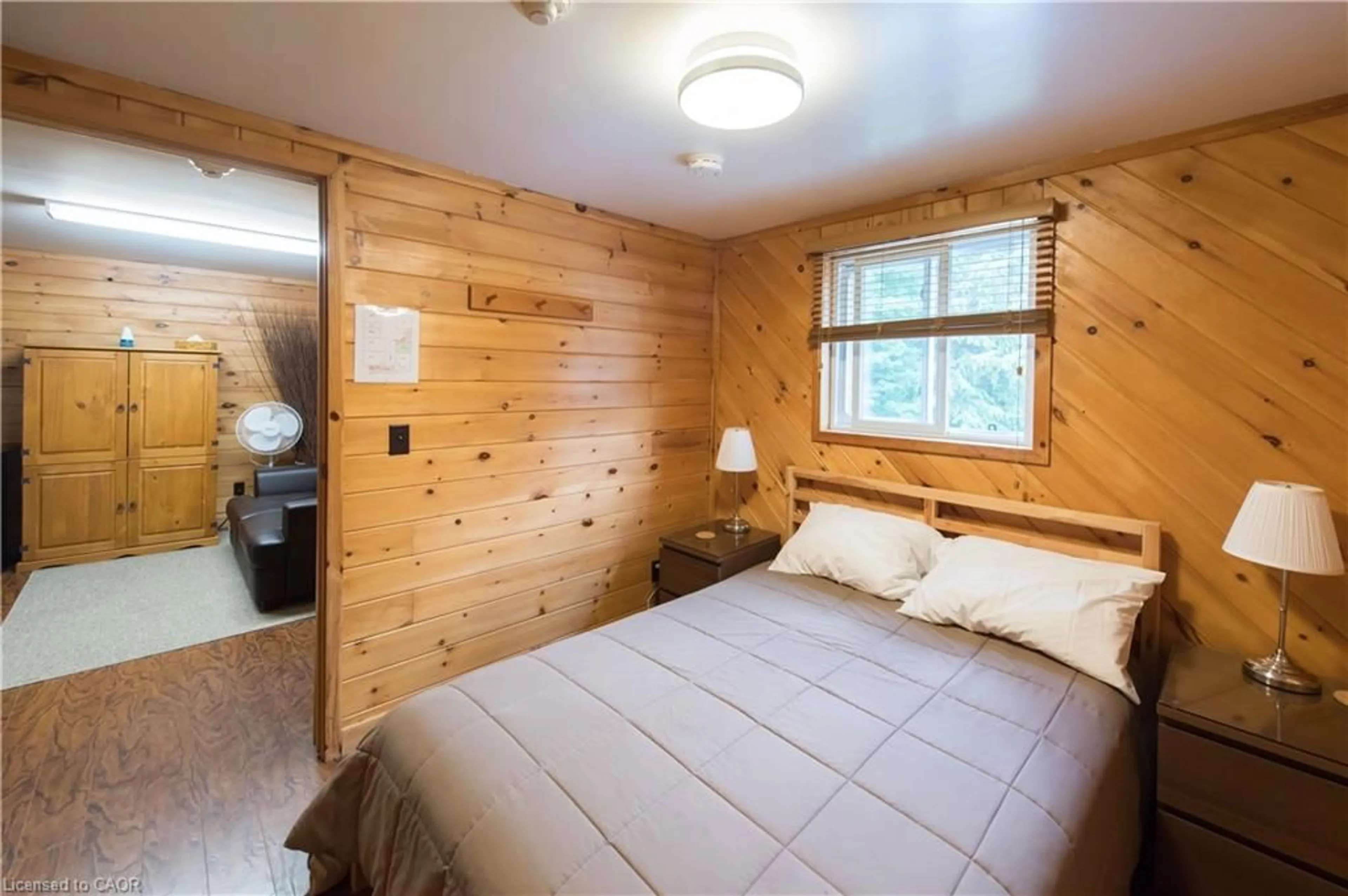 Bedroom with bed, wood/laminate floor for 3121 35 Hwy, South Algonquin Ontario K0L 2K0