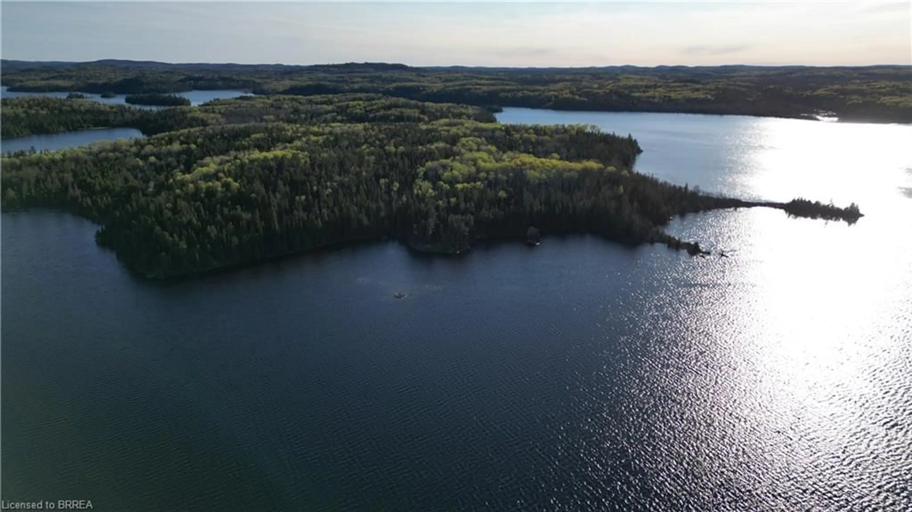 A pic from outside/outdoor area/front of a property/back of a property/a pic from drone, water/lake/river/ocean view for PMC 12918B CORE Dog Lake Bay, Missanabie Ontario P0M 2H0