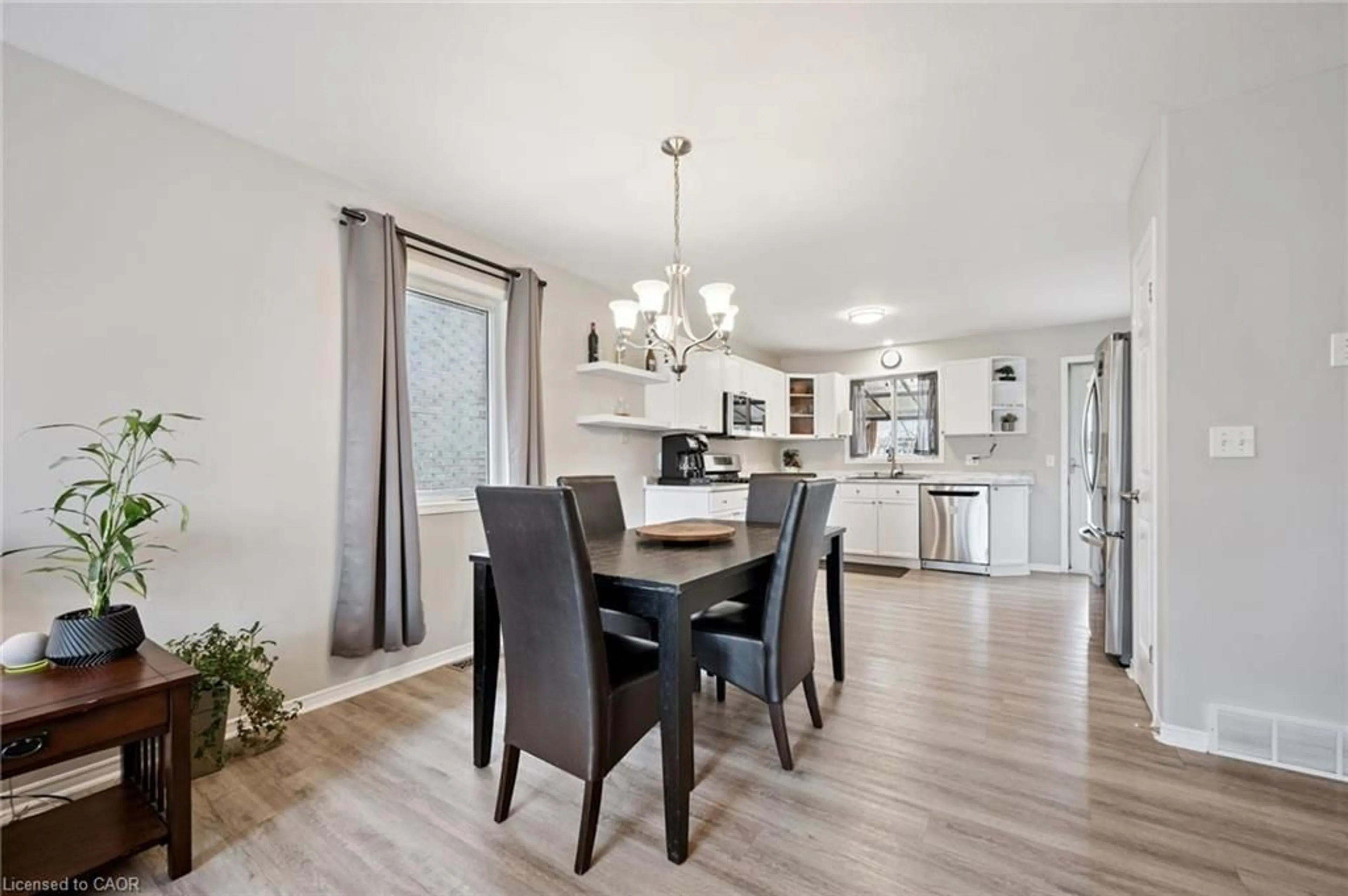 Open concept kitchen, wood/laminate floor for 119 Meadowridge Dr, St. Marys Ontario N4X 1A6