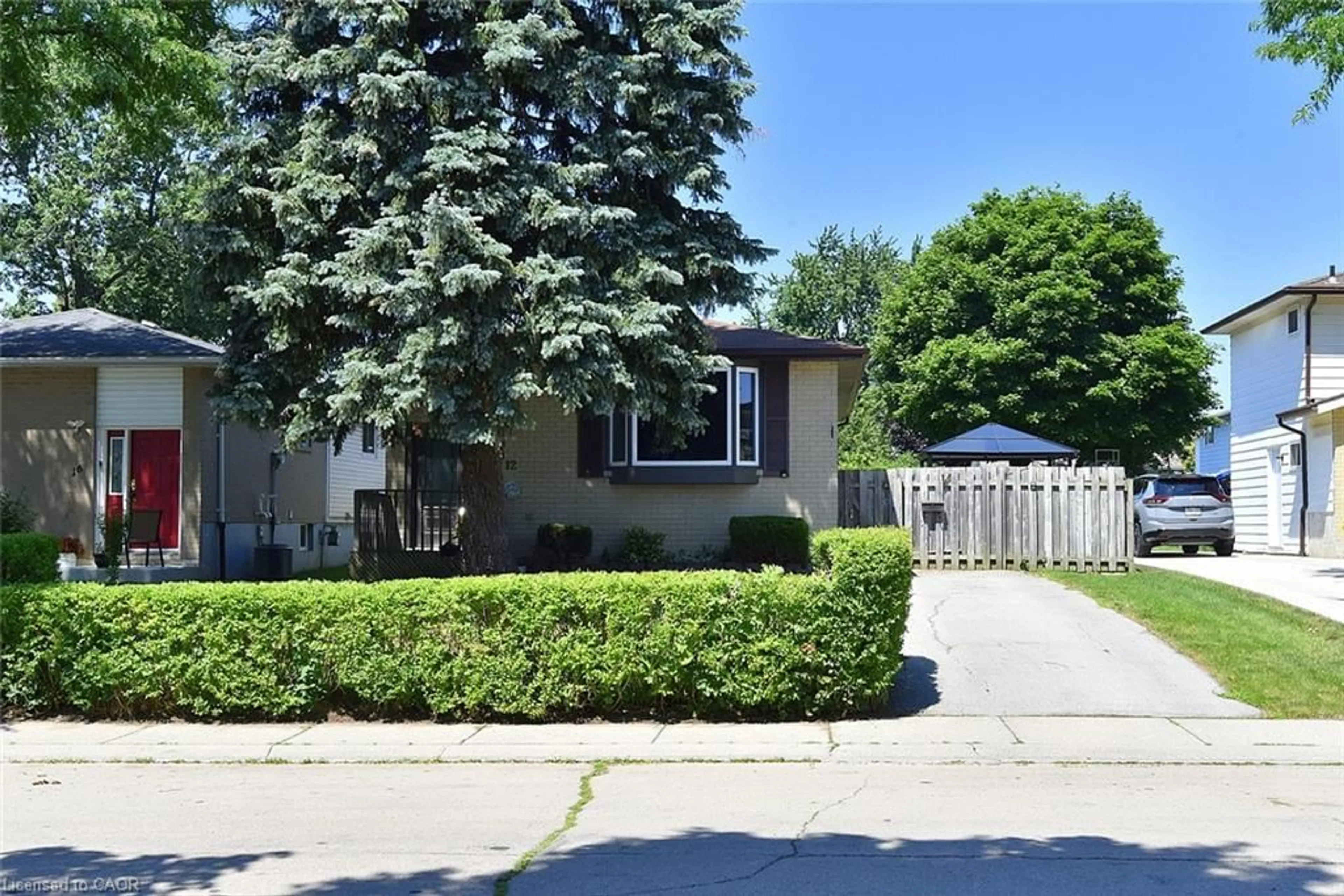 Home with vinyl exterior material, street for 12 Rainham St, Hamilton Ontario L8W 1J8