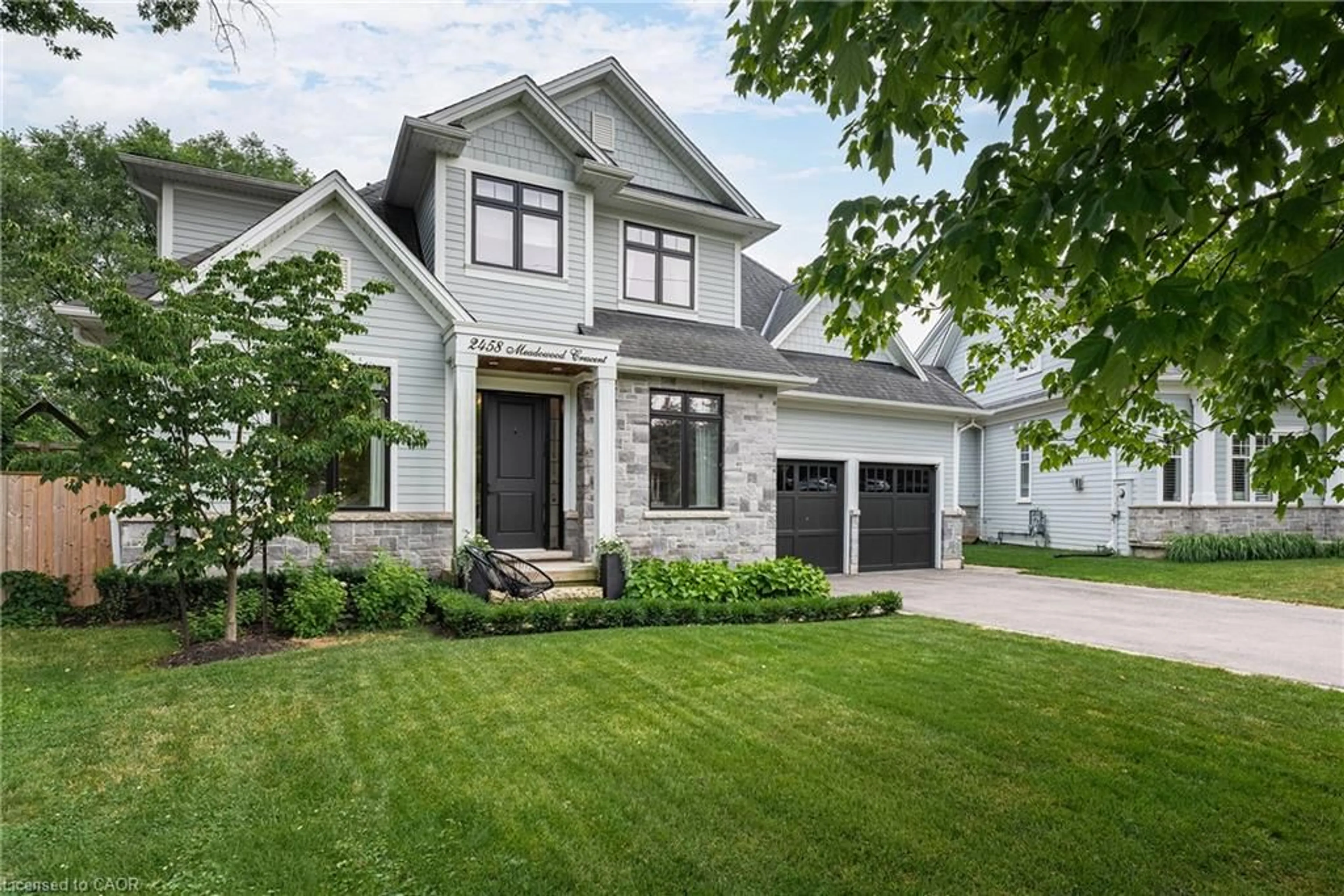 Home with brick exterior material, street for 2458 Meadowood Cres, Oakville Ontario L6L 1V6