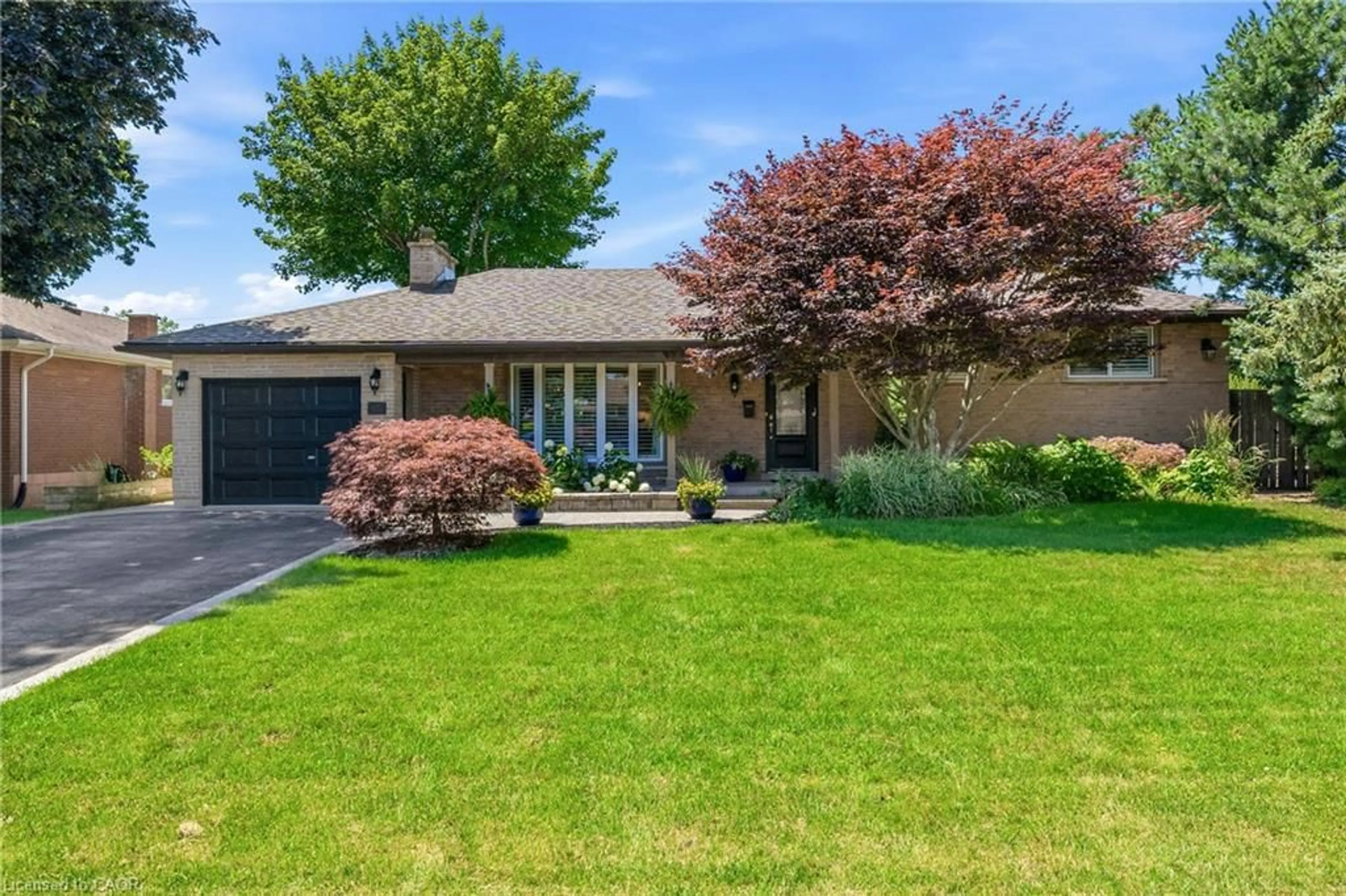 Home with brick exterior material, street for 302 Harmony Rd, Hamilton Ontario L9G 2T2