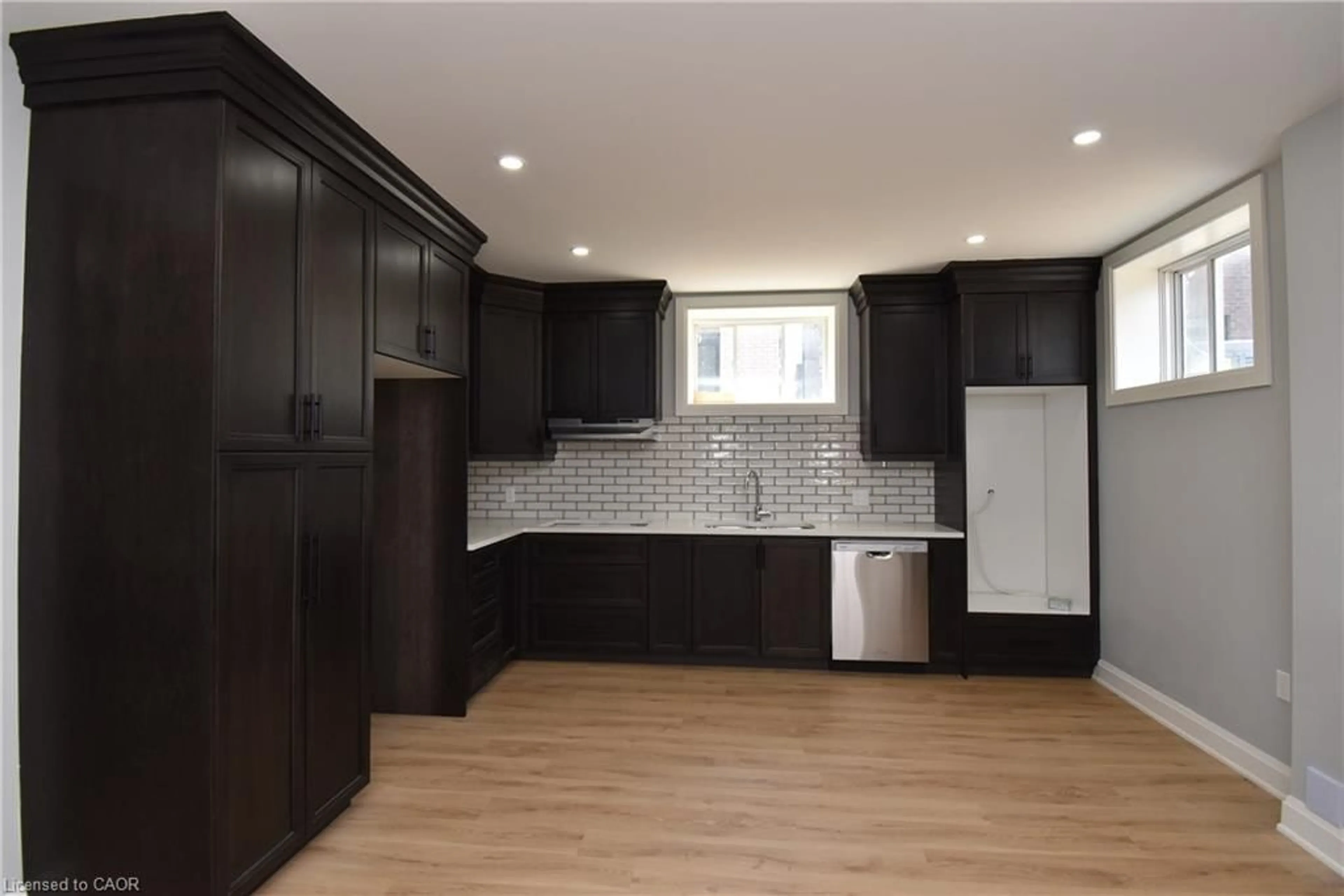 Open concept kitchen, wood/laminate floor for 1184 West 5th St, Hamilton Ontario L9B 1J6