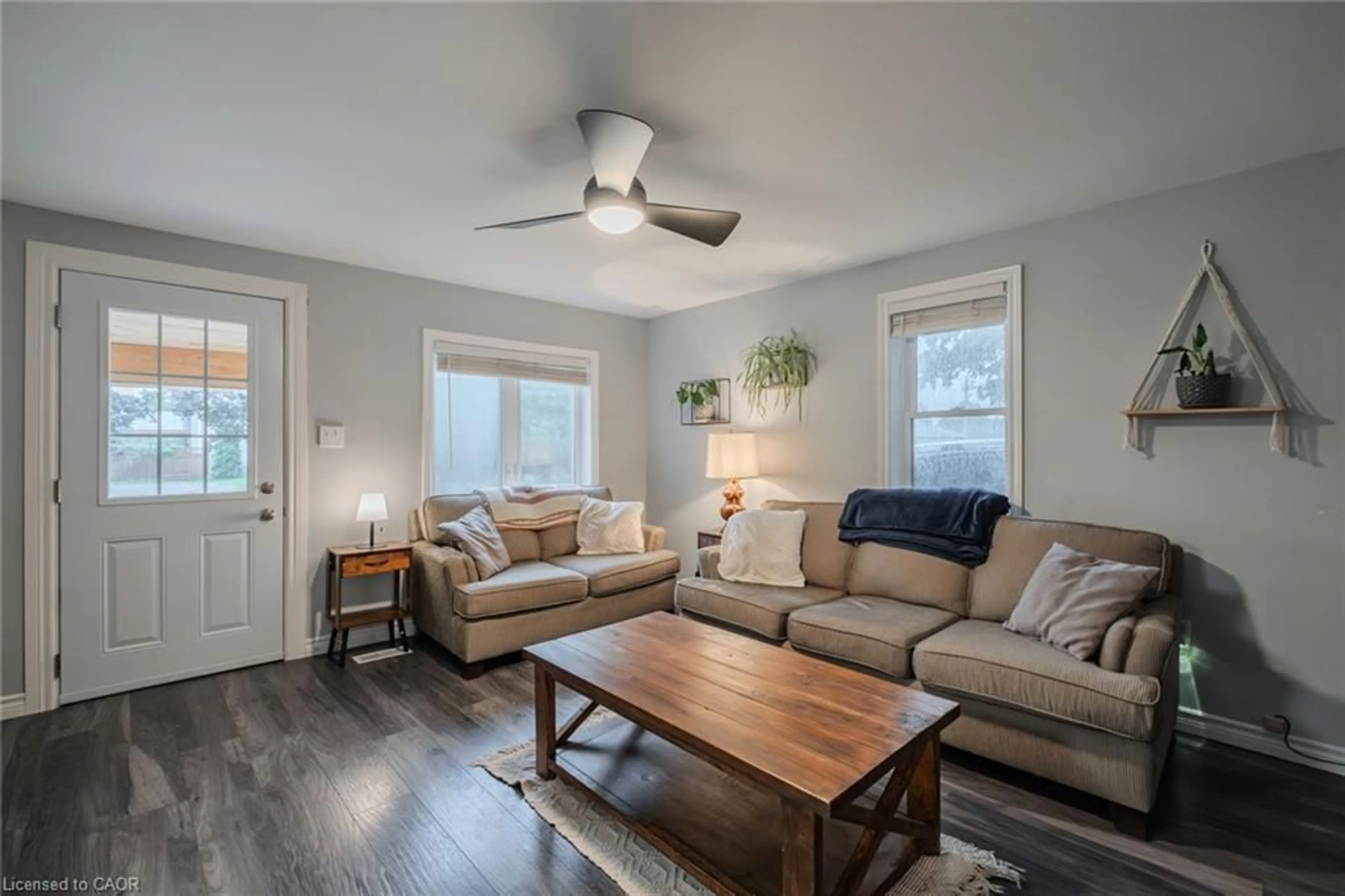 Living room with furniture, wood/laminate floor for 79 Mechanic St, Waterford Ontario N0E 1Y0