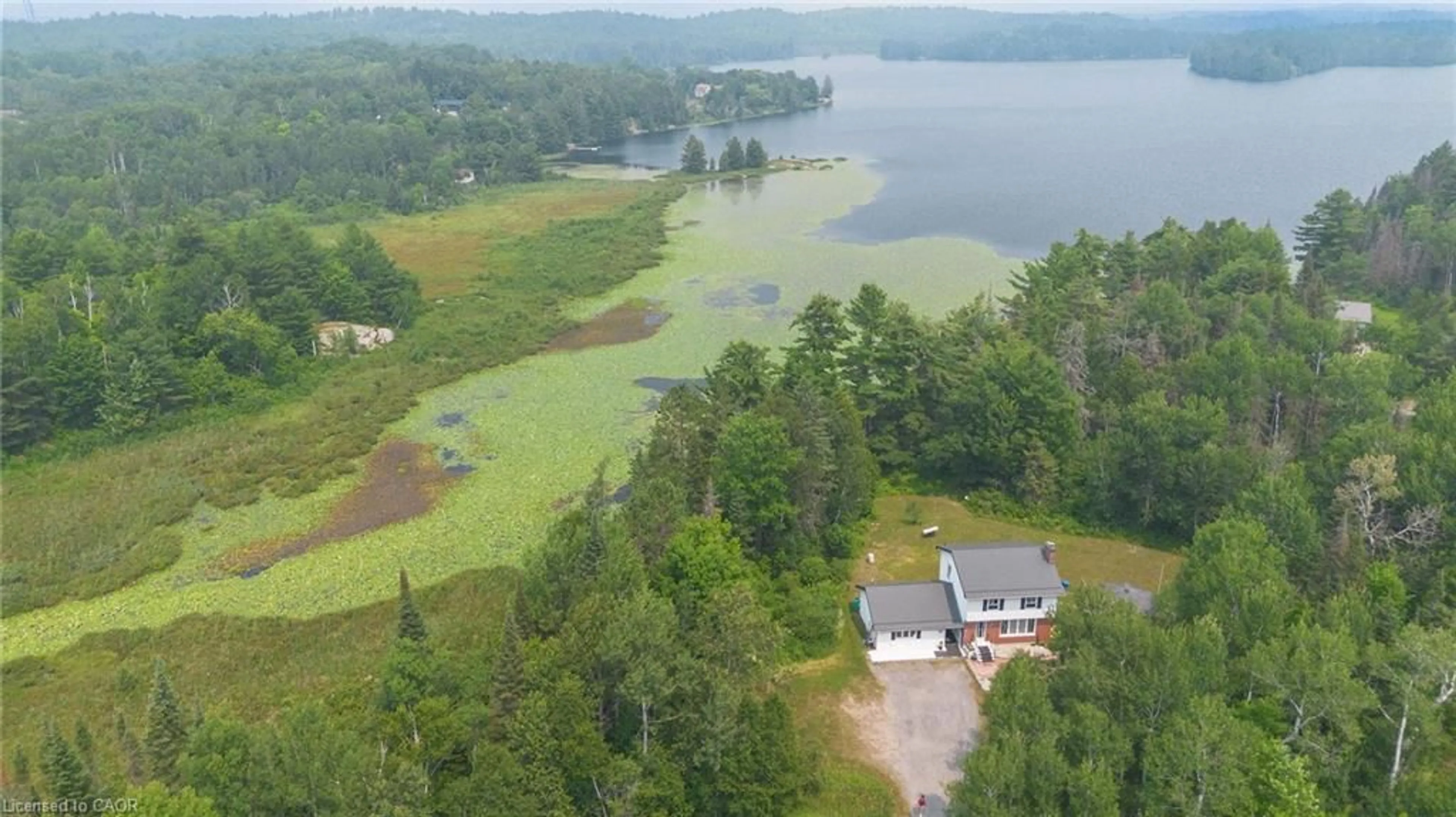 A pic from outside/outdoor area/front of a property/back of a property/a pic from drone, water/lake/river/ocean view for 1013 Hopkins Hill Rd, Espanola Ontario P5E 1T4
