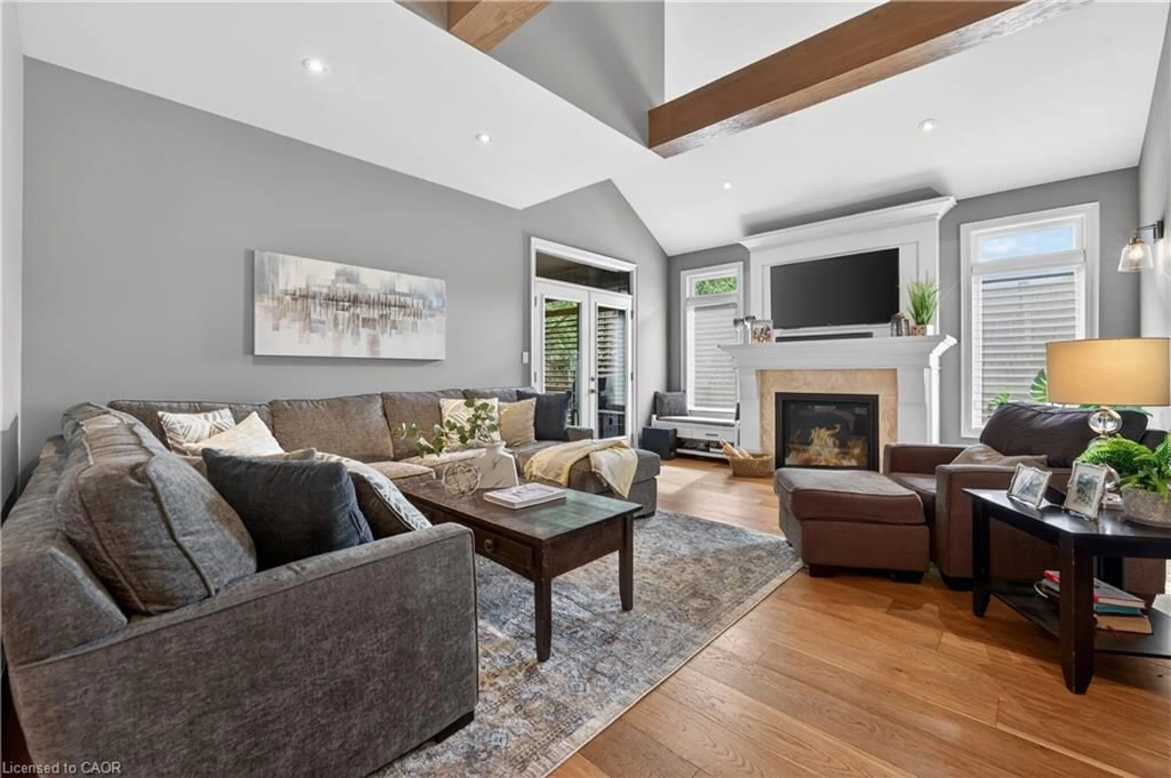 Living room with furniture, wood/laminate floor for 116 Livingston Ave, Grimsby Ontario L3M 1L6