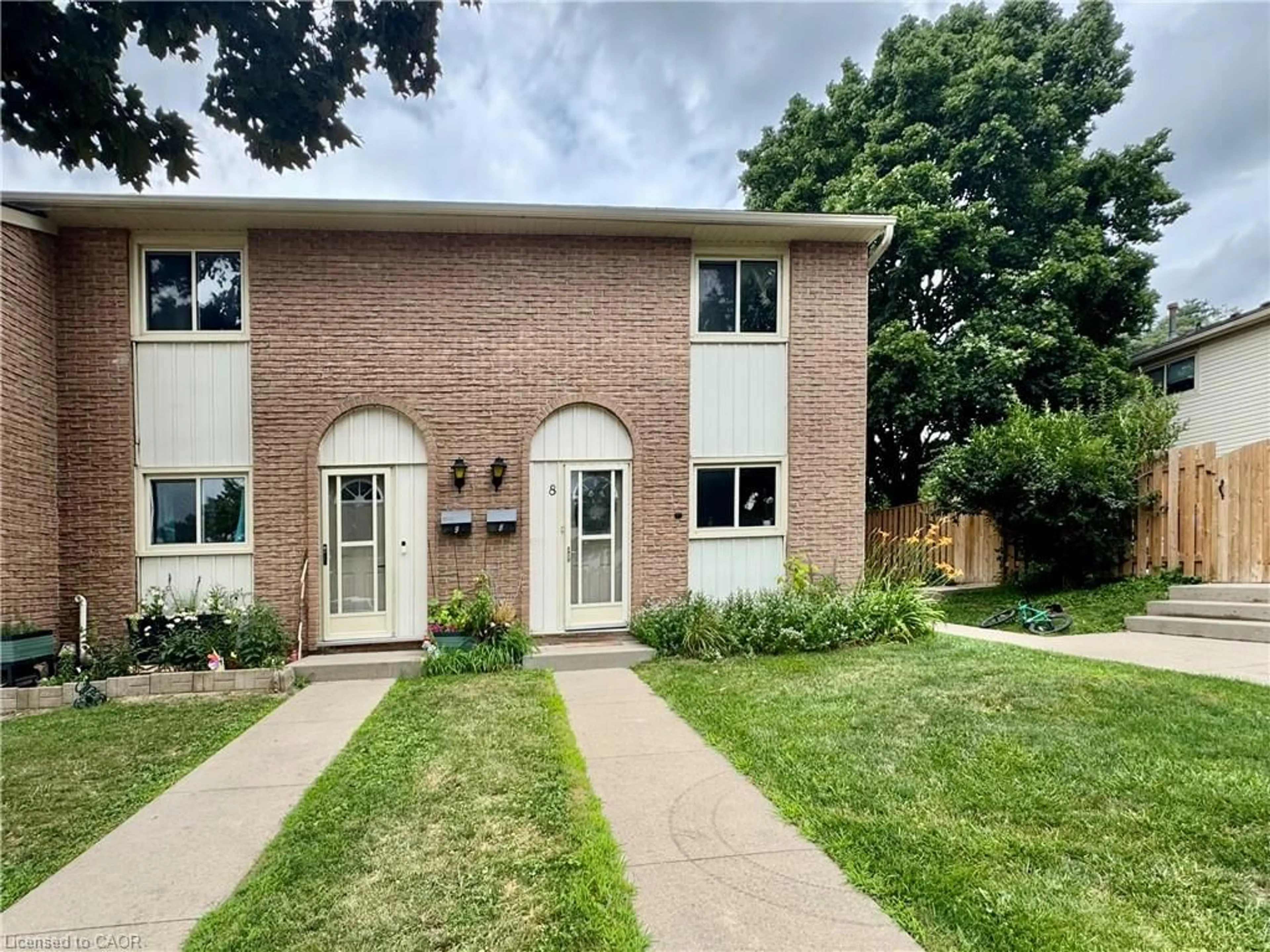Home with brick exterior material, street for 165 Green Valley Dr #8, Kitchener Ontario N2P 1K3