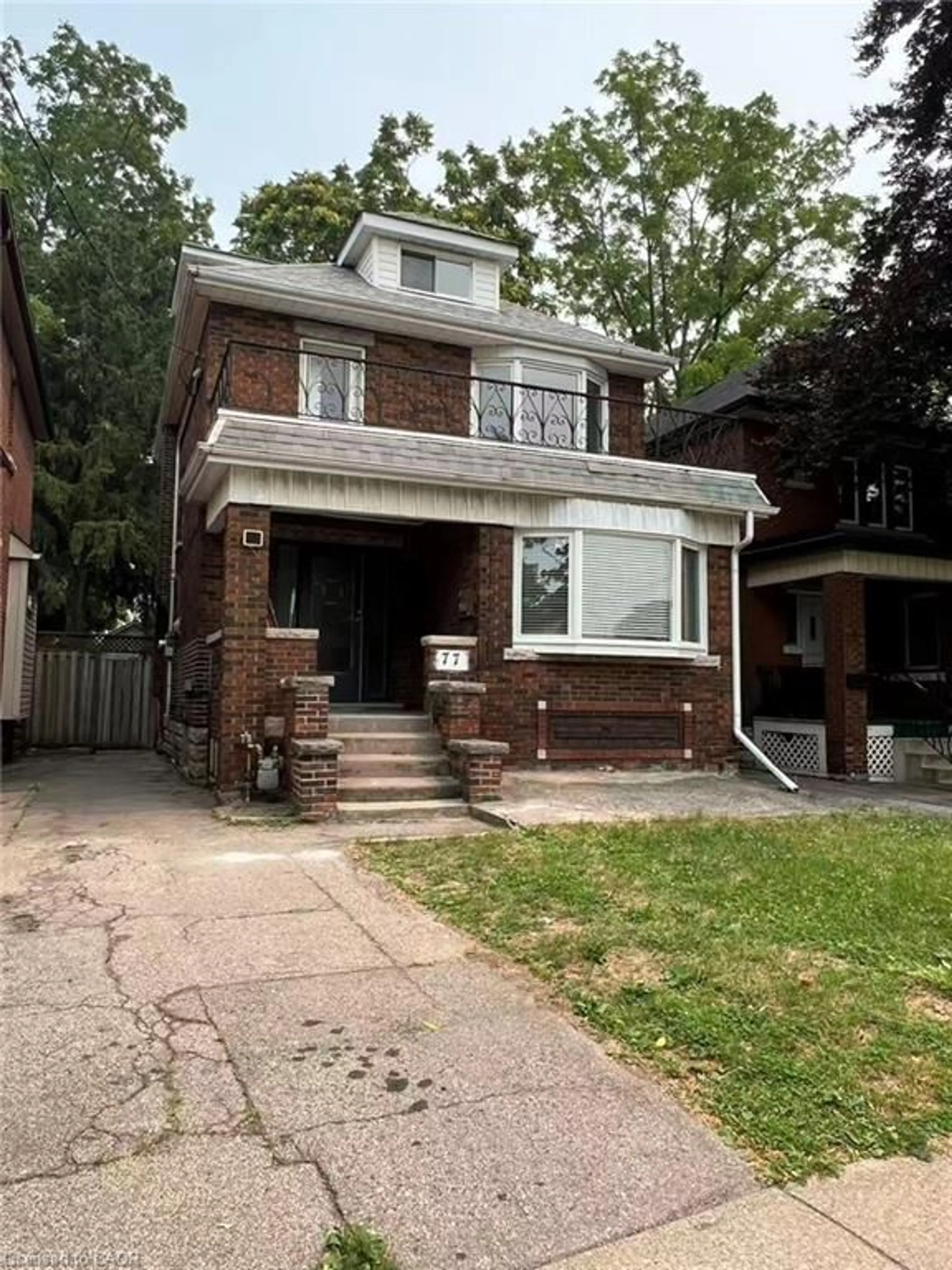 Home with brick exterior material, street for 77 Paisley Ave, Hamilton Ontario L8S 1V4