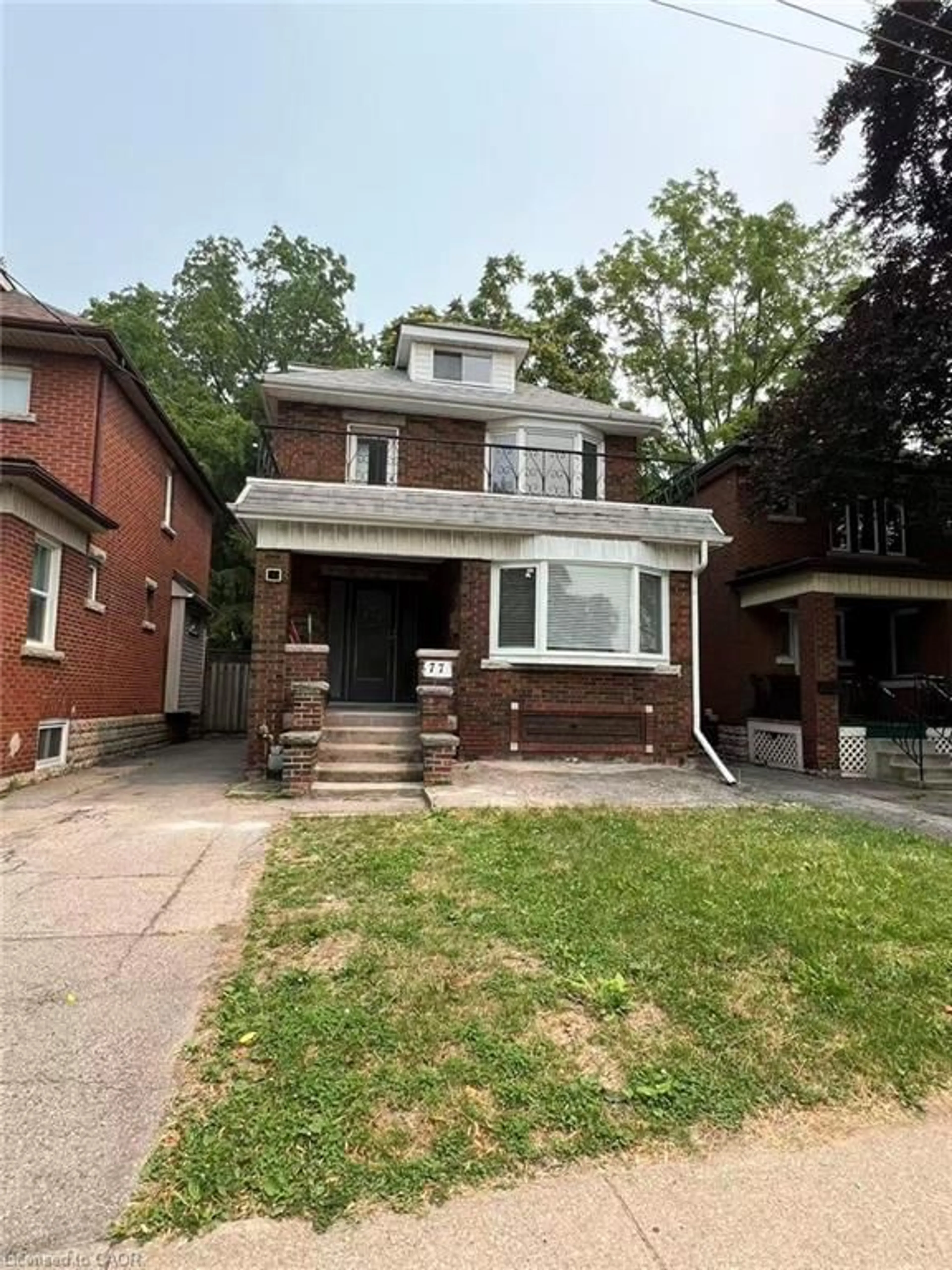 Home with brick exterior material, street for 77 Paisley Ave, Hamilton Ontario L8S 1V4