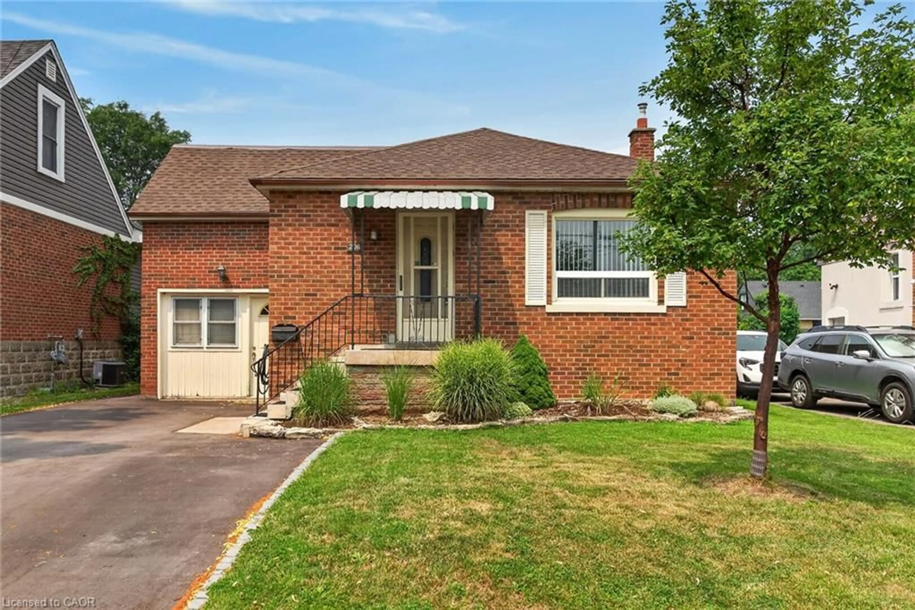 Home with brick exterior material, street for 206 East 13th St, Hamilton Ontario L9A 3Z7