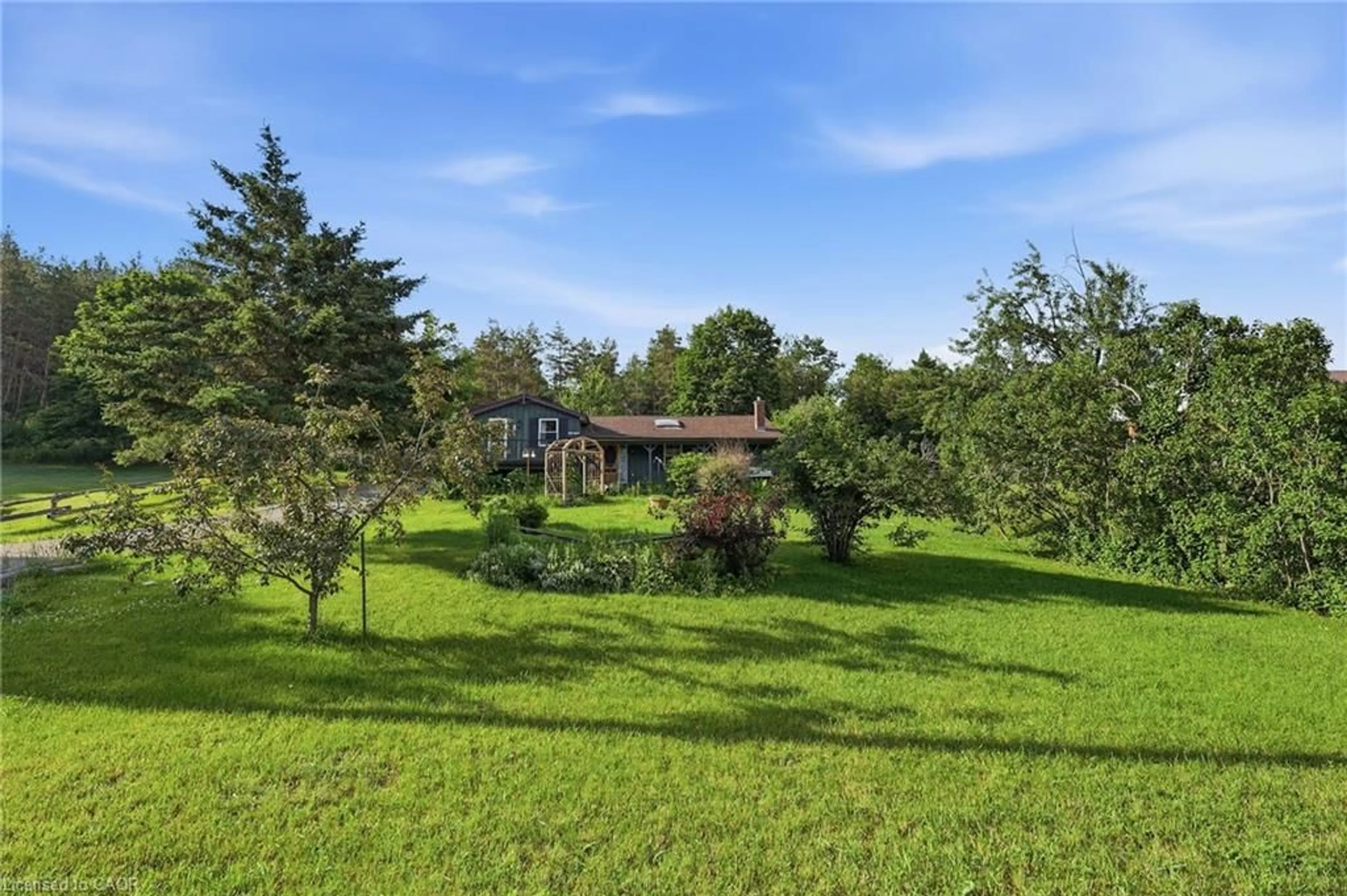A pic from outside/outdoor area/front of a property/back of a property/a pic from drone, forest/trees view for 8 Jakeman St, Kawartha Lakes Ontario L0A 1A0