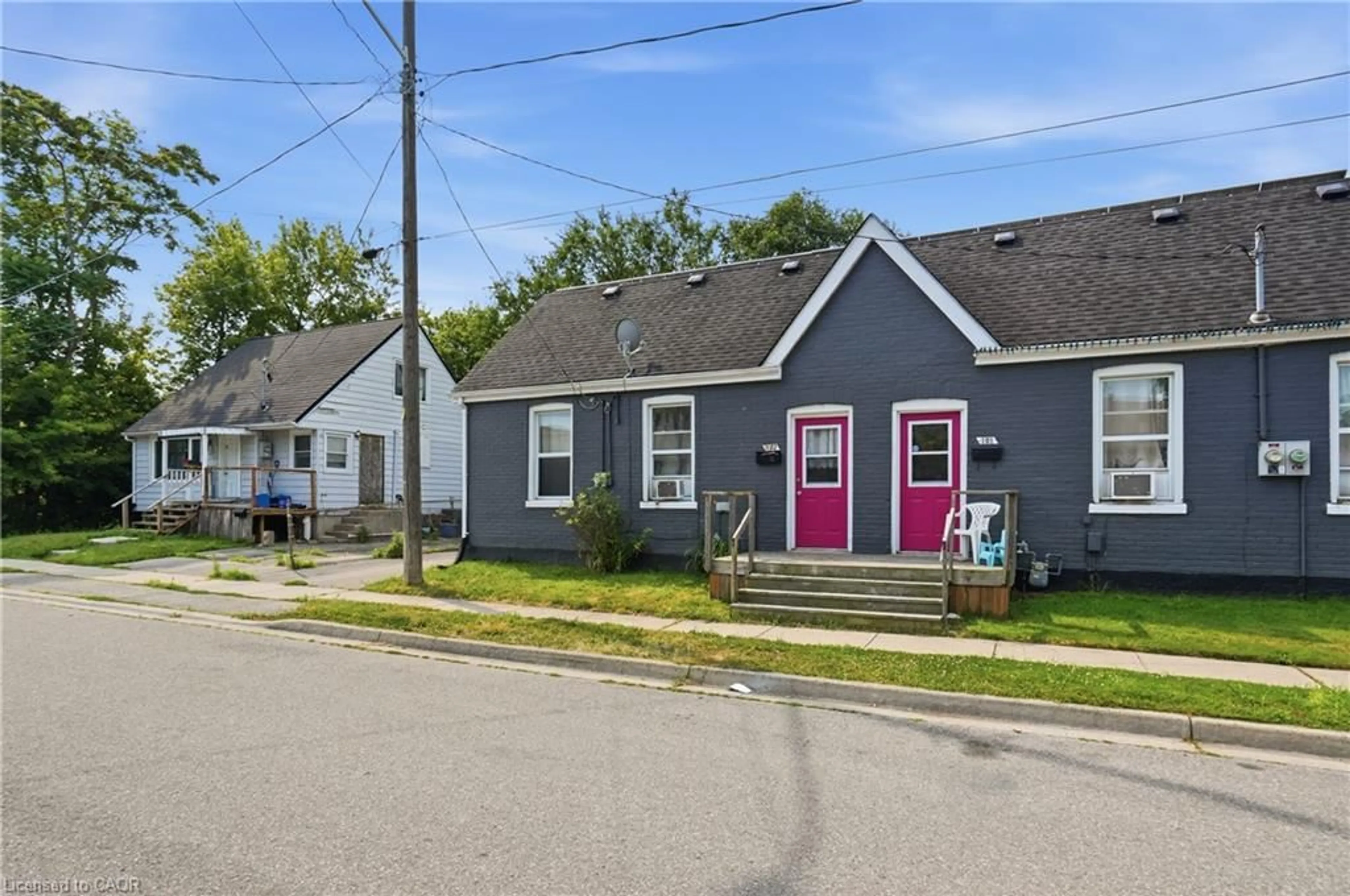 Home with vinyl exterior material, street for 101-103 Sarah St, Brantford Ontario N3S 3A4