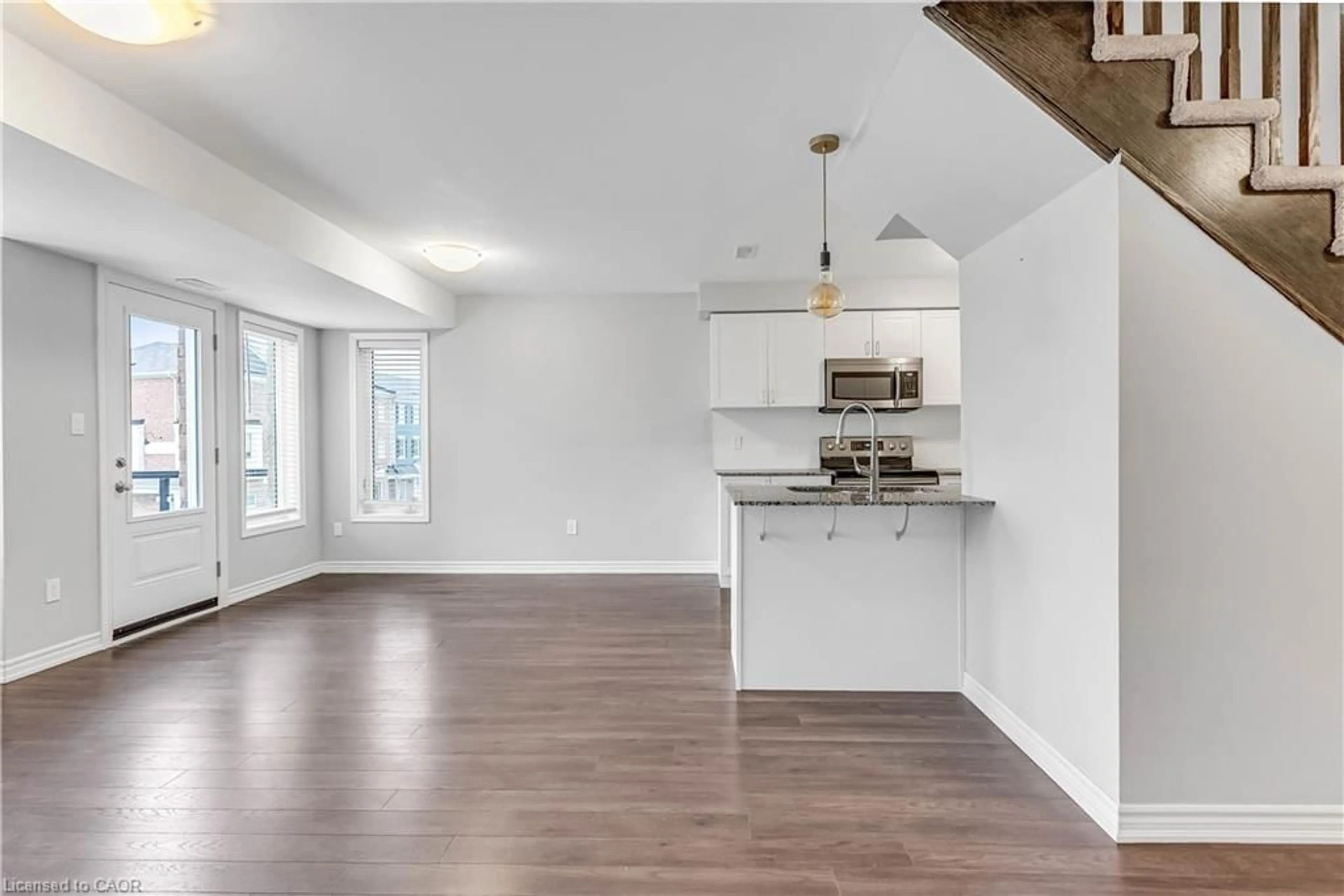 Open concept kitchen, wood/laminate floor for 96 Daylily Lane, Kitchener Ontario N2R 0L7