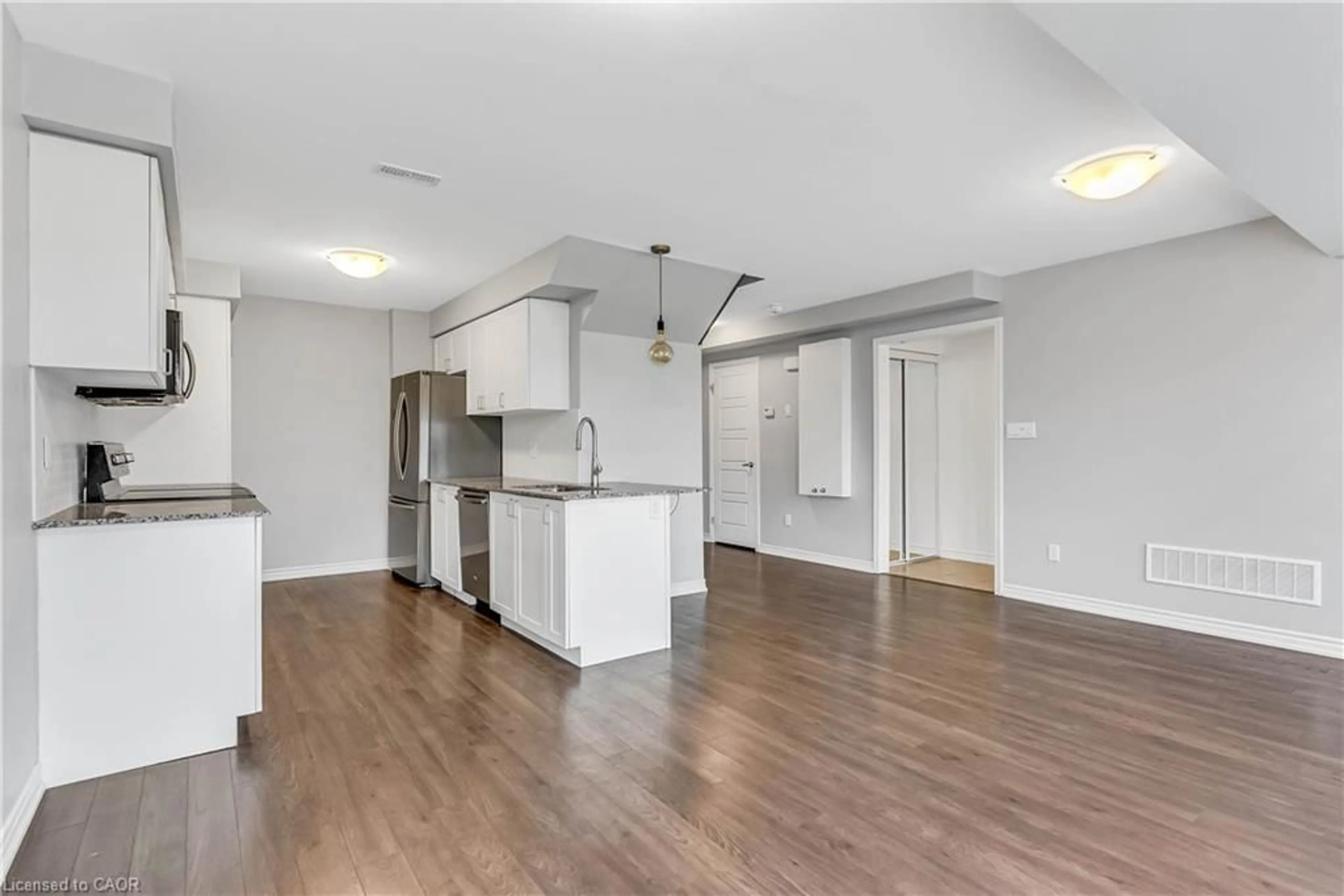 Open concept kitchen, wood/laminate floor for 96 Daylily Lane, Kitchener Ontario N2R 0L7