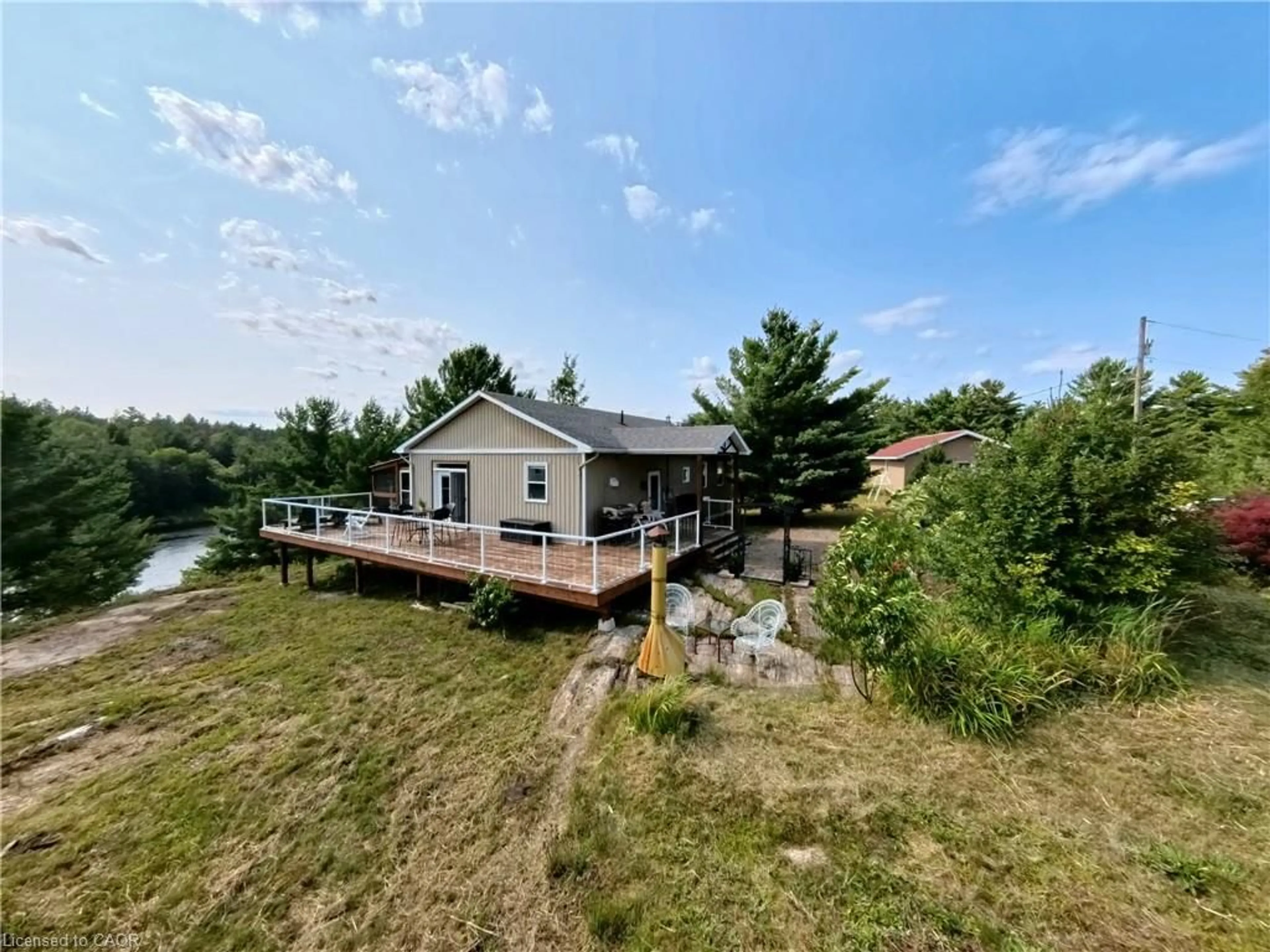 A pic from outside/outdoor area/front of a property/back of a property/a pic from drone, water/lake/river/ocean view for 244 Riverview Dr, Alban Ontario P0M 1A0