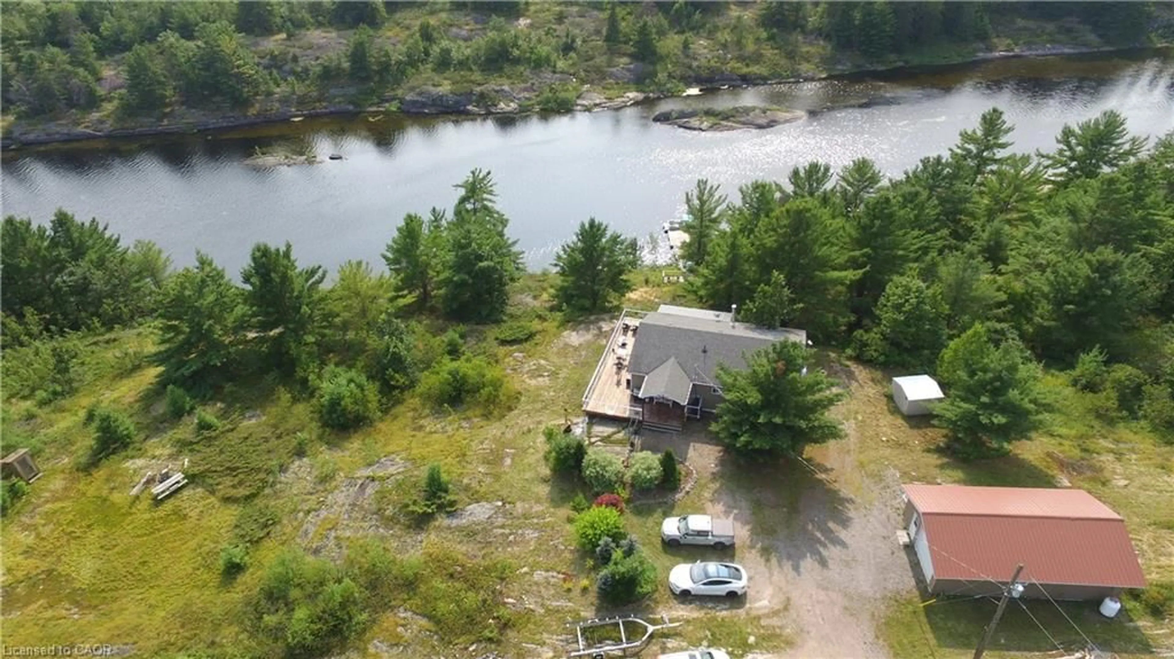 A pic from outside/outdoor area/front of a property/back of a property/a pic from drone, water/lake/river/ocean view for 244 Riverview Dr, Alban Ontario P0M 1A0