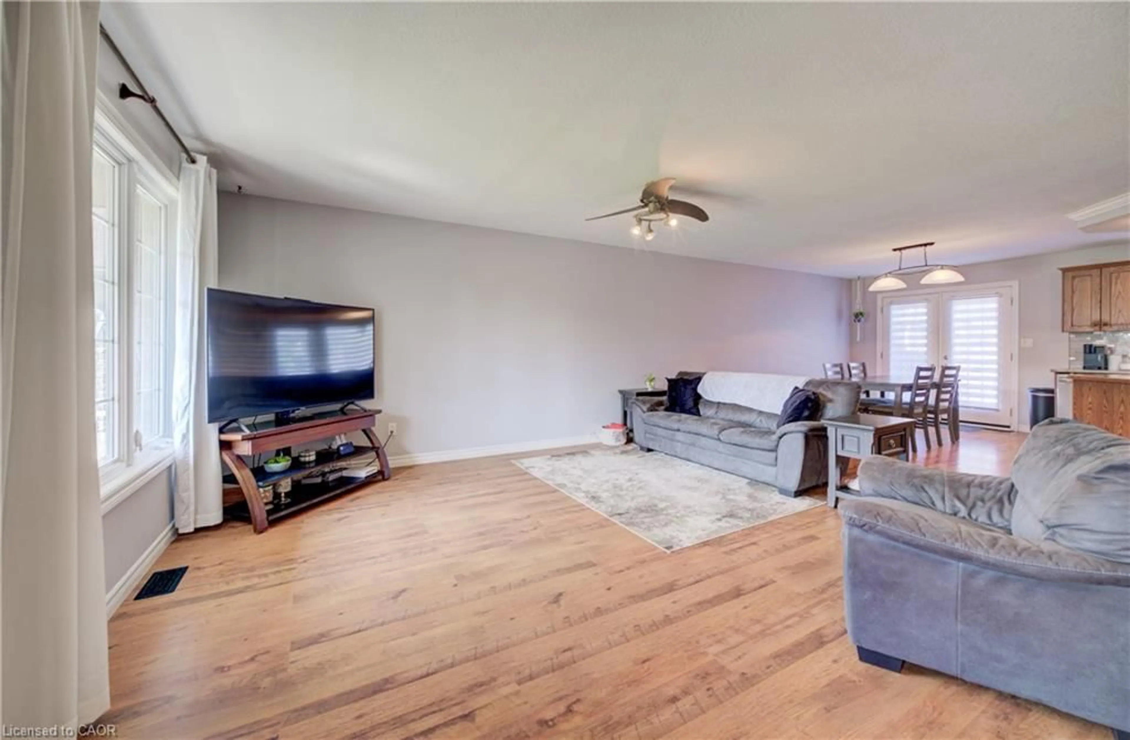 Living room with furniture, wood/laminate floor for 44 Geddes St, Clifford Ontario N0G 1M0