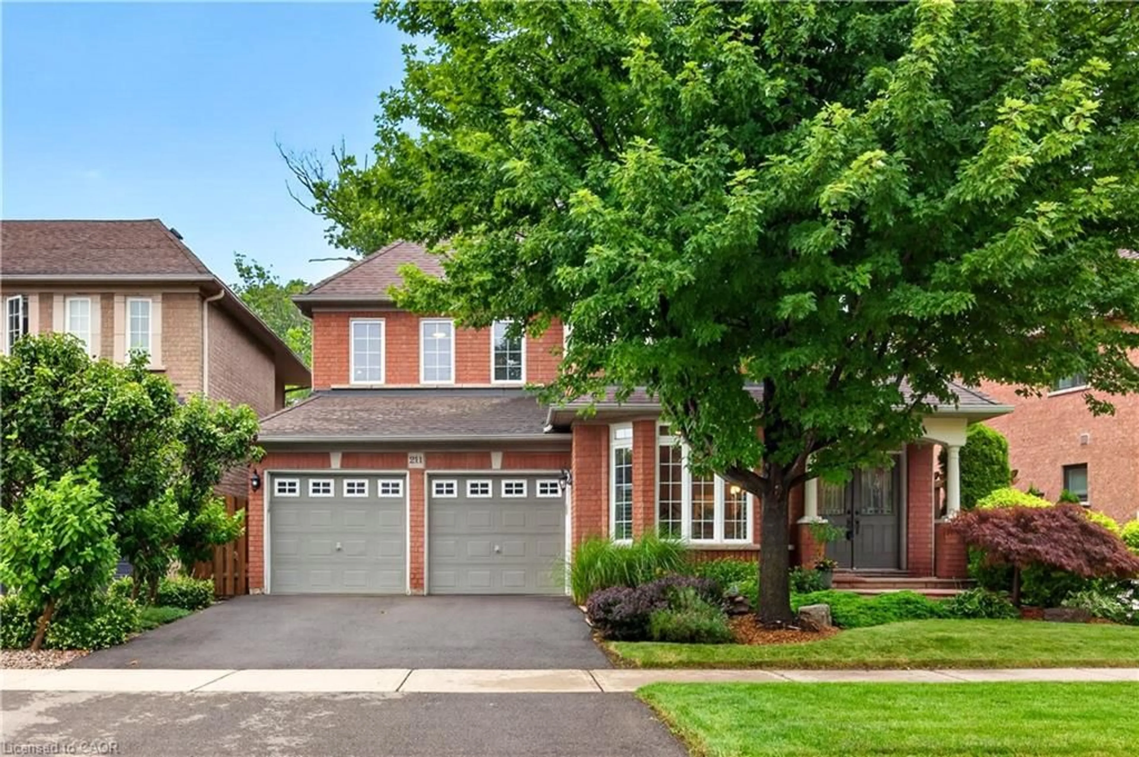 Home with brick exterior material, street for 211 Creek Path Ave, Oakville Ontario L5L 6T5