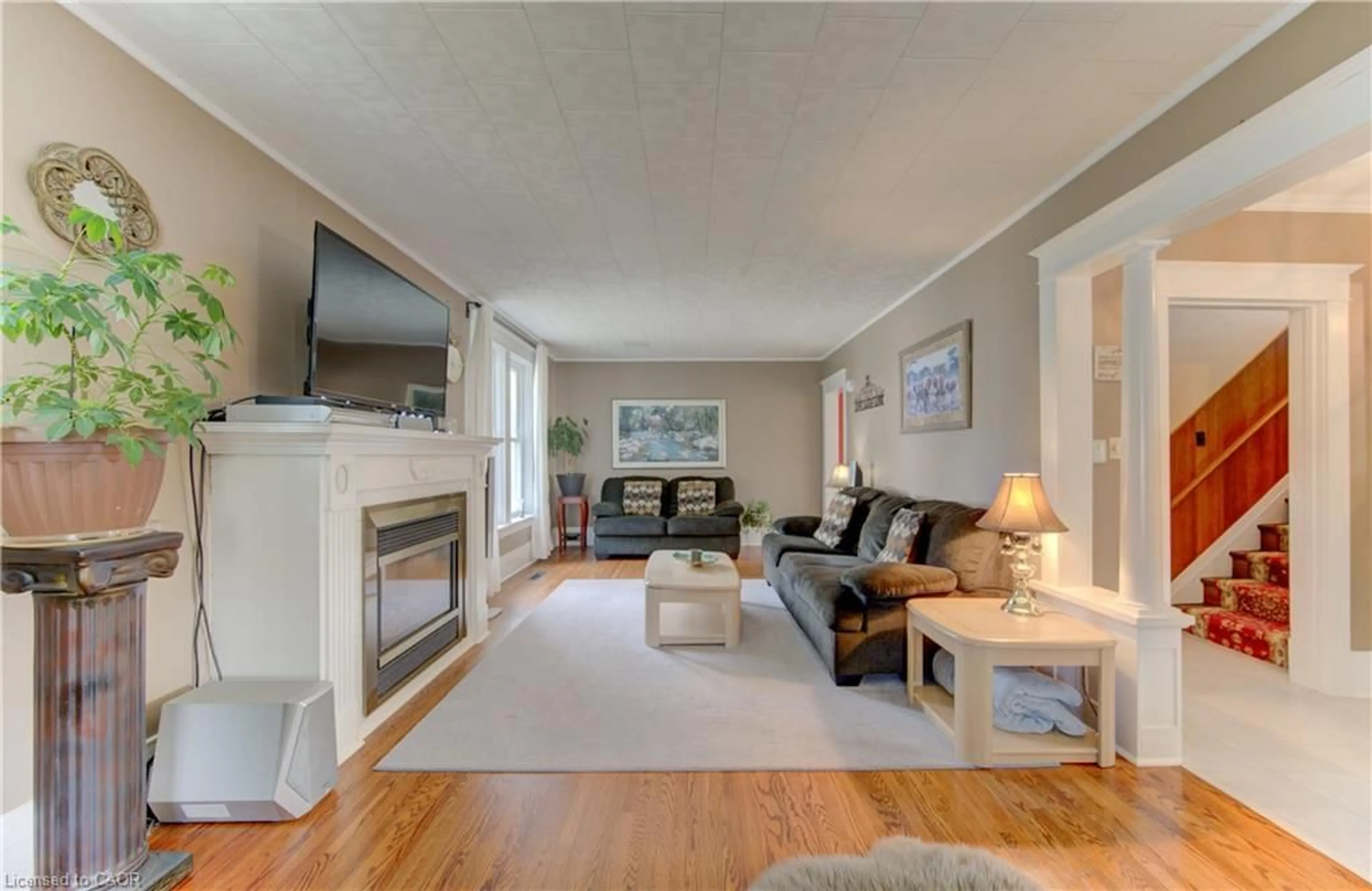 Living room with furniture, wood/laminate floor for 46 Main St, Princeton Ontario N0J 1V0