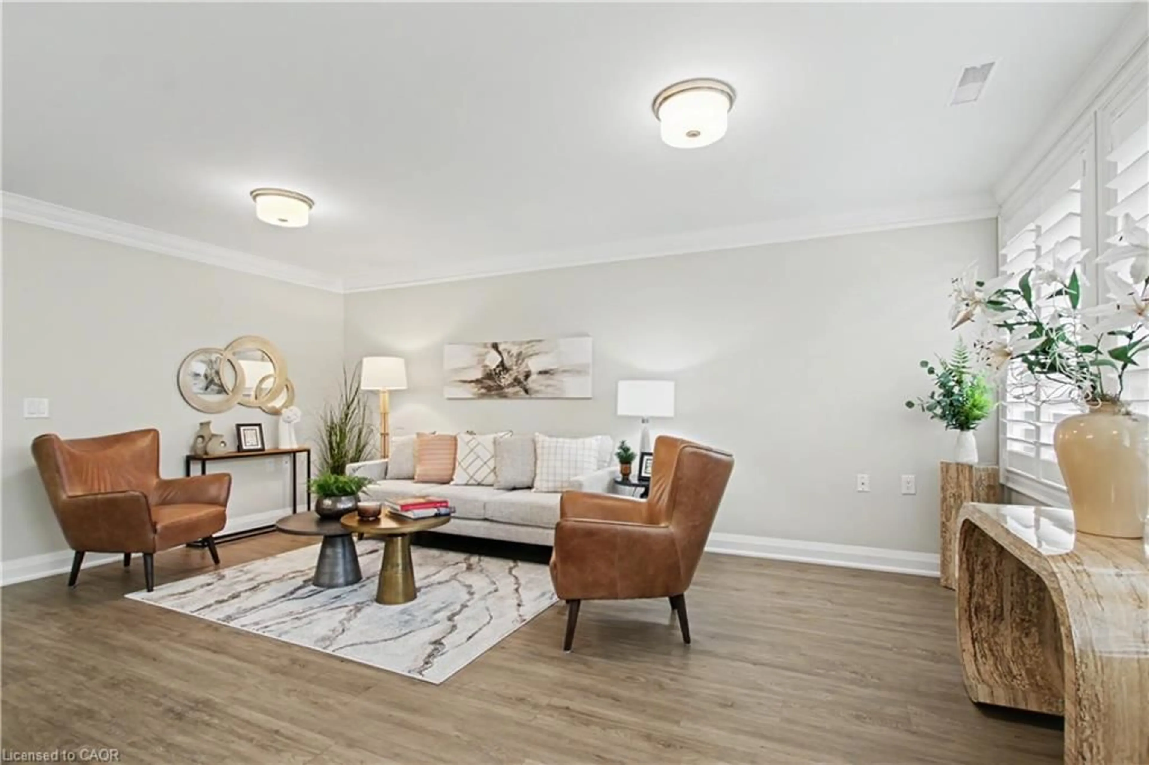 Living room with furniture, wood/laminate floor for 82 Szollosy Cir, Hamilton Ontario L9B 1T8