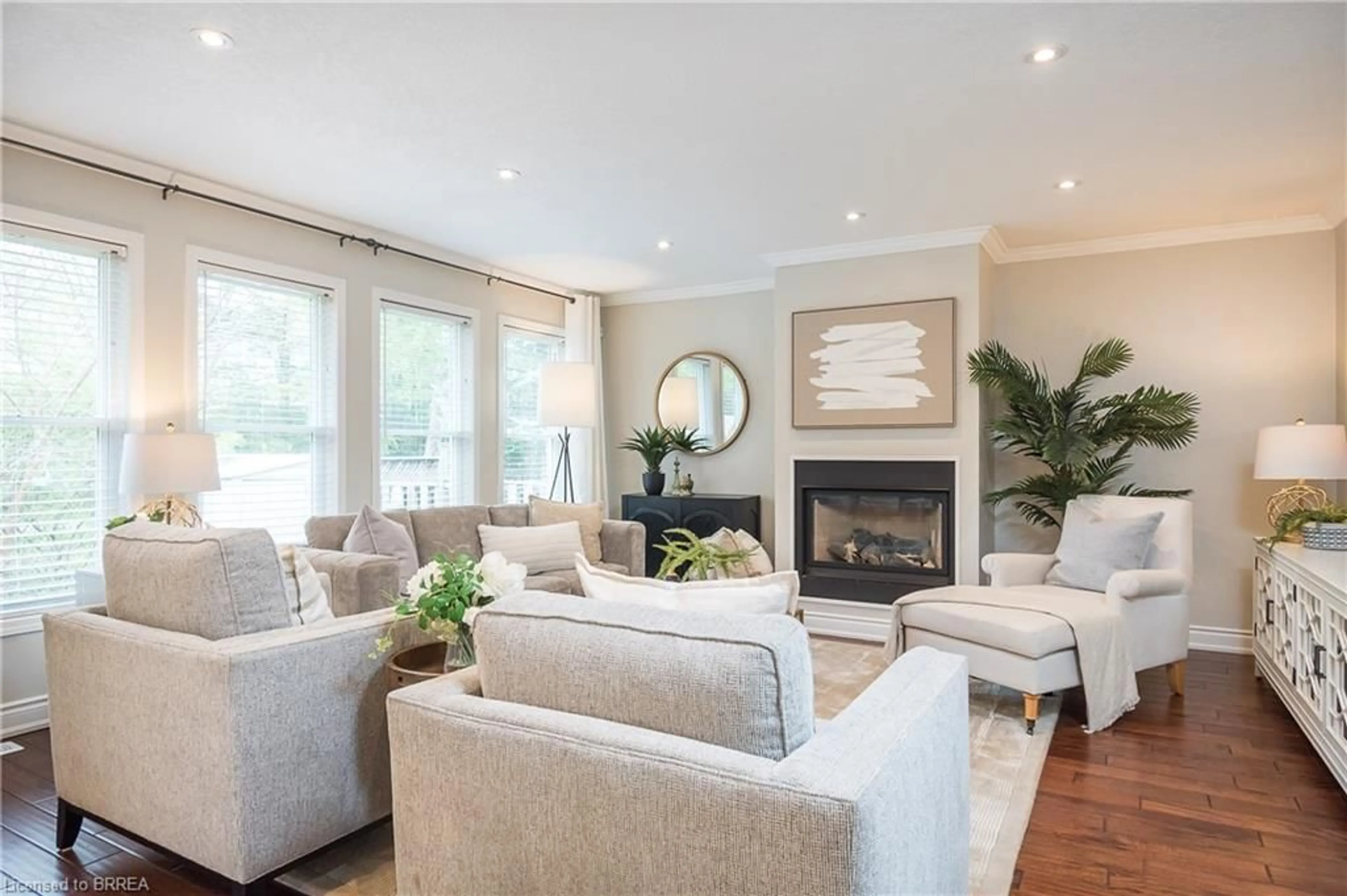 Living room with furniture, wood/laminate floor for 23 Baggs Cres, Cambridge Ontario N1T 2E9
