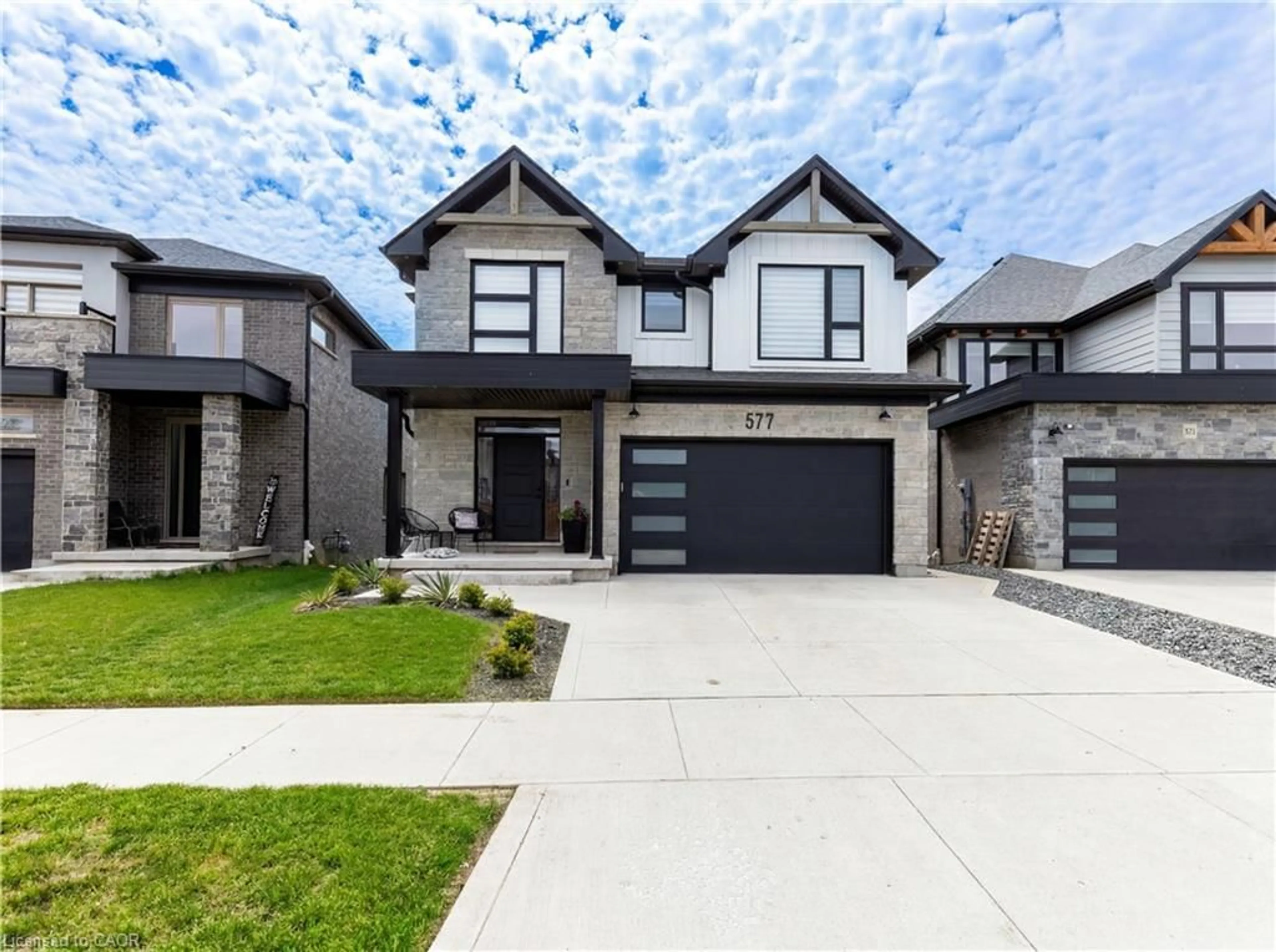 Home with brick exterior material, street for 577 Doonwoods Cres, Kitchener Ontario N2P 0E5