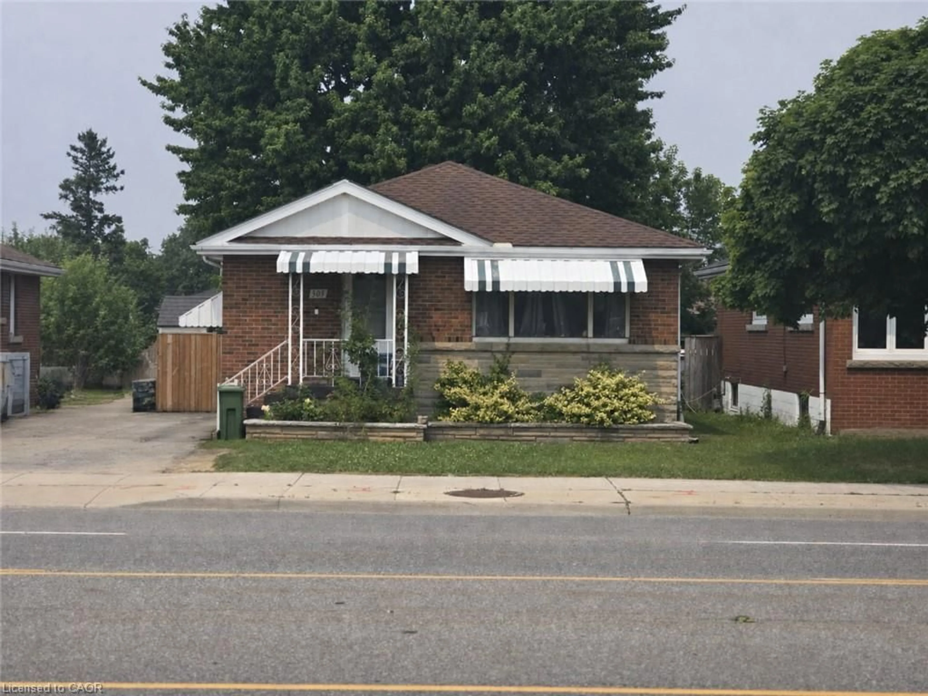 Home with brick exterior material, street for 305 Mohawk Rd, Hamilton Ontario L9A 2J5
