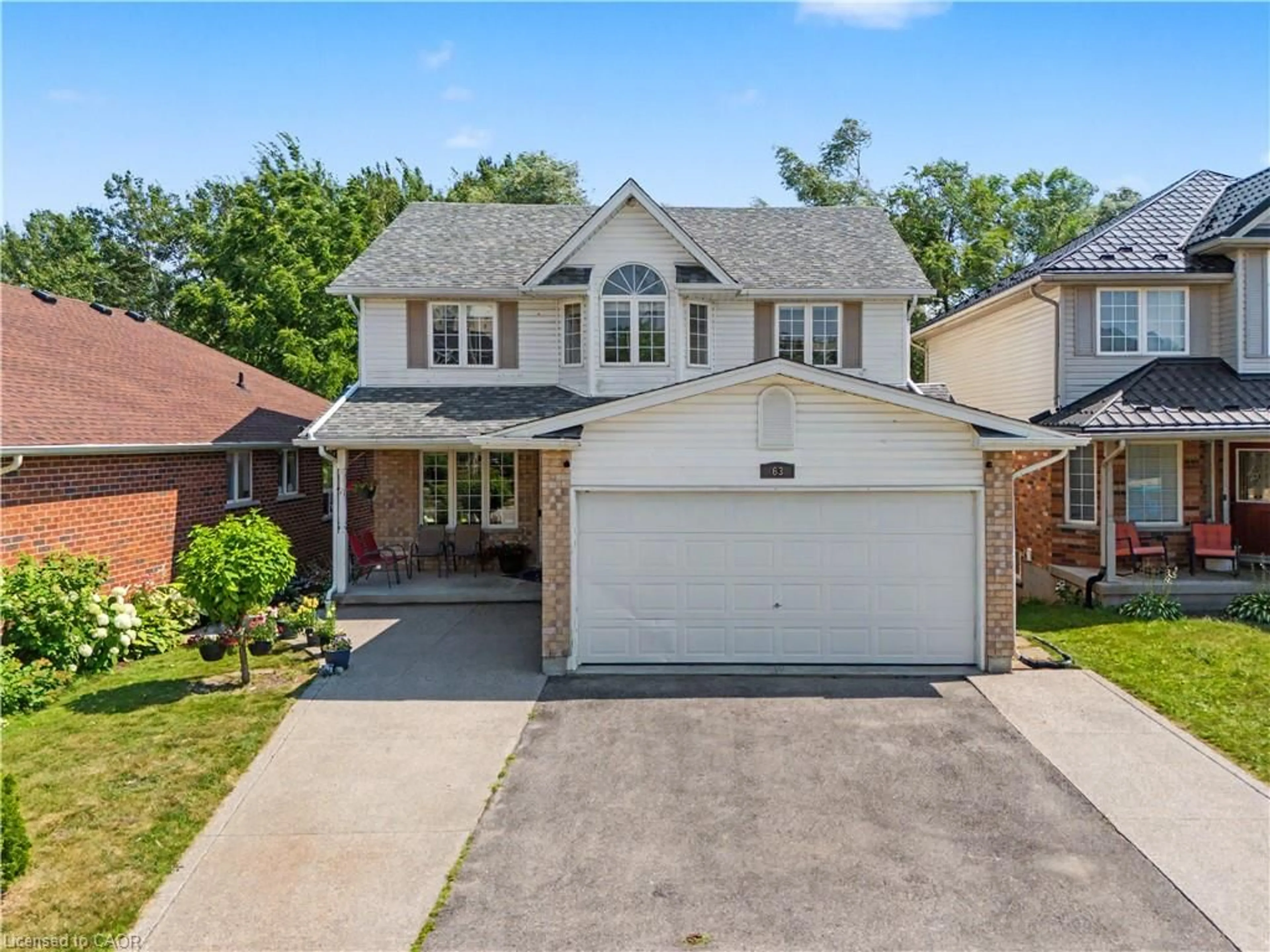Home with brick exterior material, street for 63 Brisbane Dr, Kitchener Ontario N2C 2T6