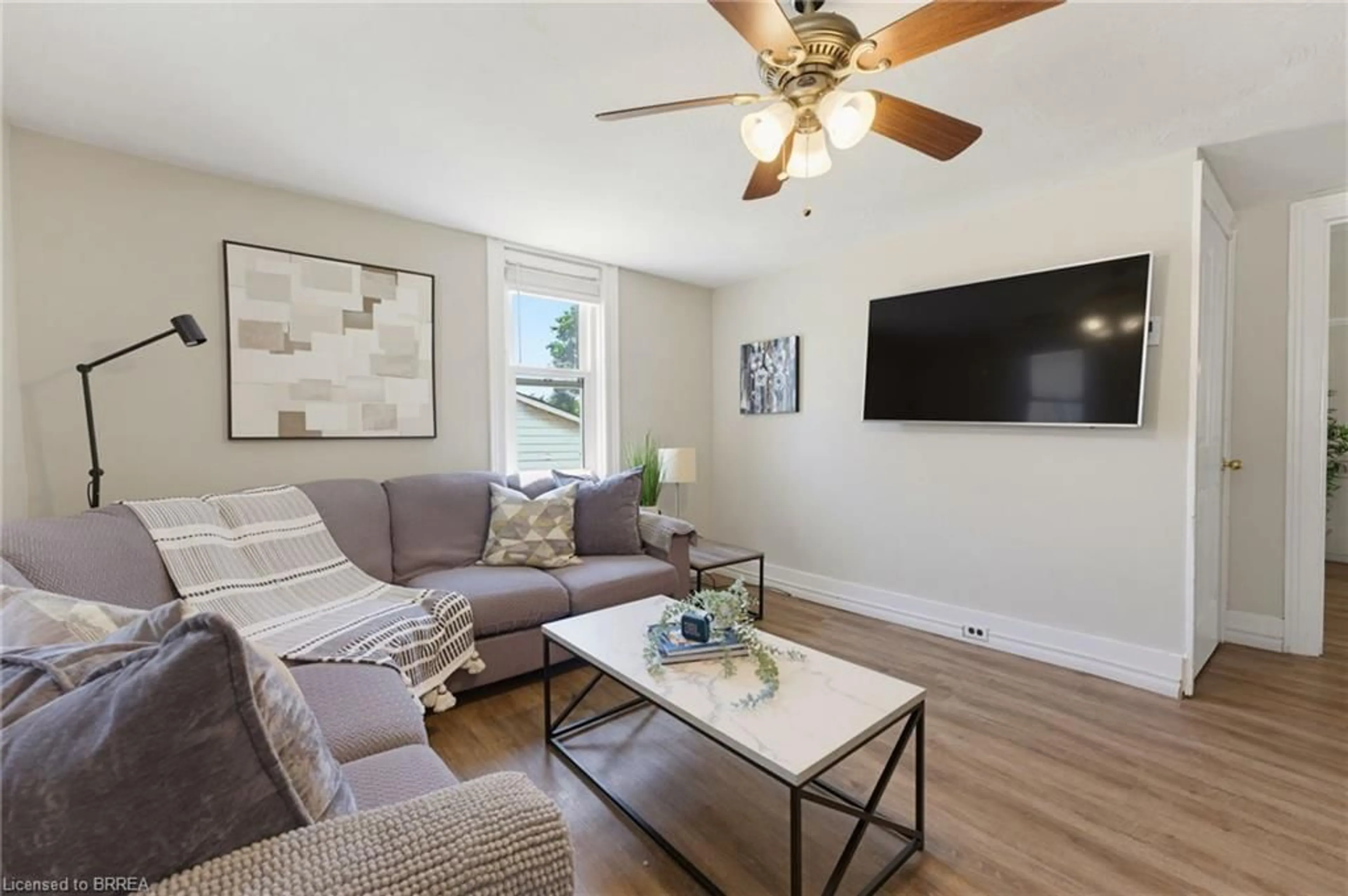 Living room with furniture, wood/laminate floor for 7 Lorimer St, St. George Ontario N0E 1N0