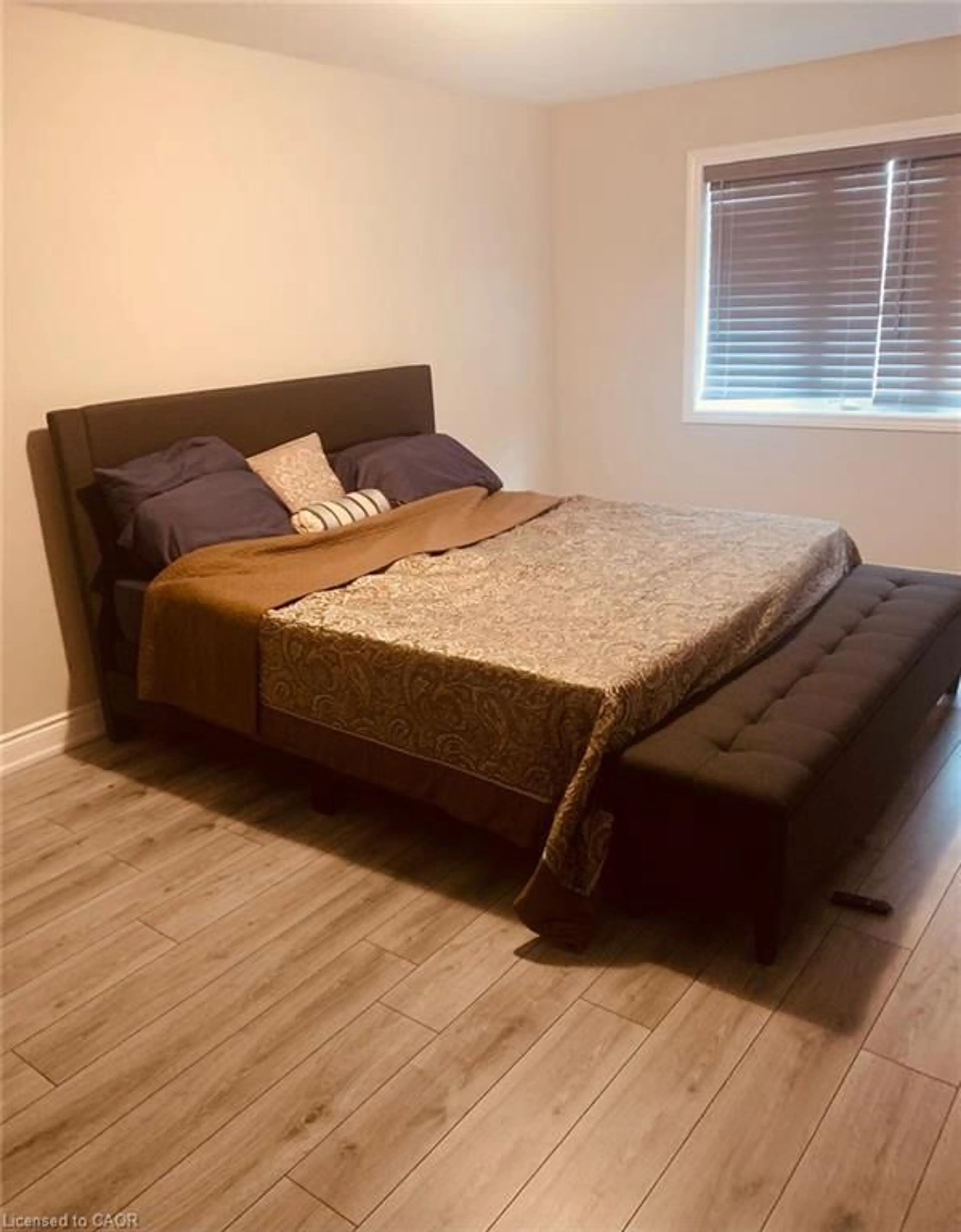 Bedroom with bed, wood/laminate floor for 62 Homestead Way, Thorold Ontario L2V 0H1