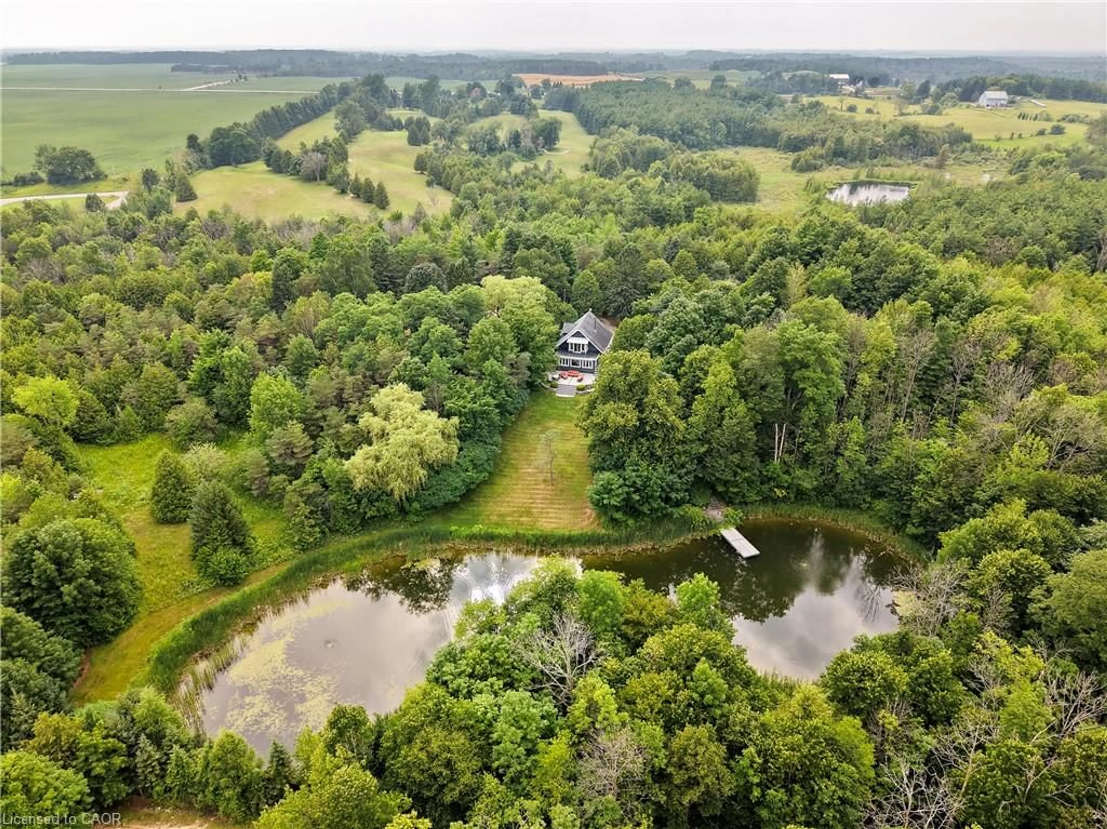 A pic from outside/outdoor area/front of a property/back of a property/a pic from drone, water/lake/river/ocean view for 123083 Southgate Rd 12, Wellington North Ontario N0G 2L0