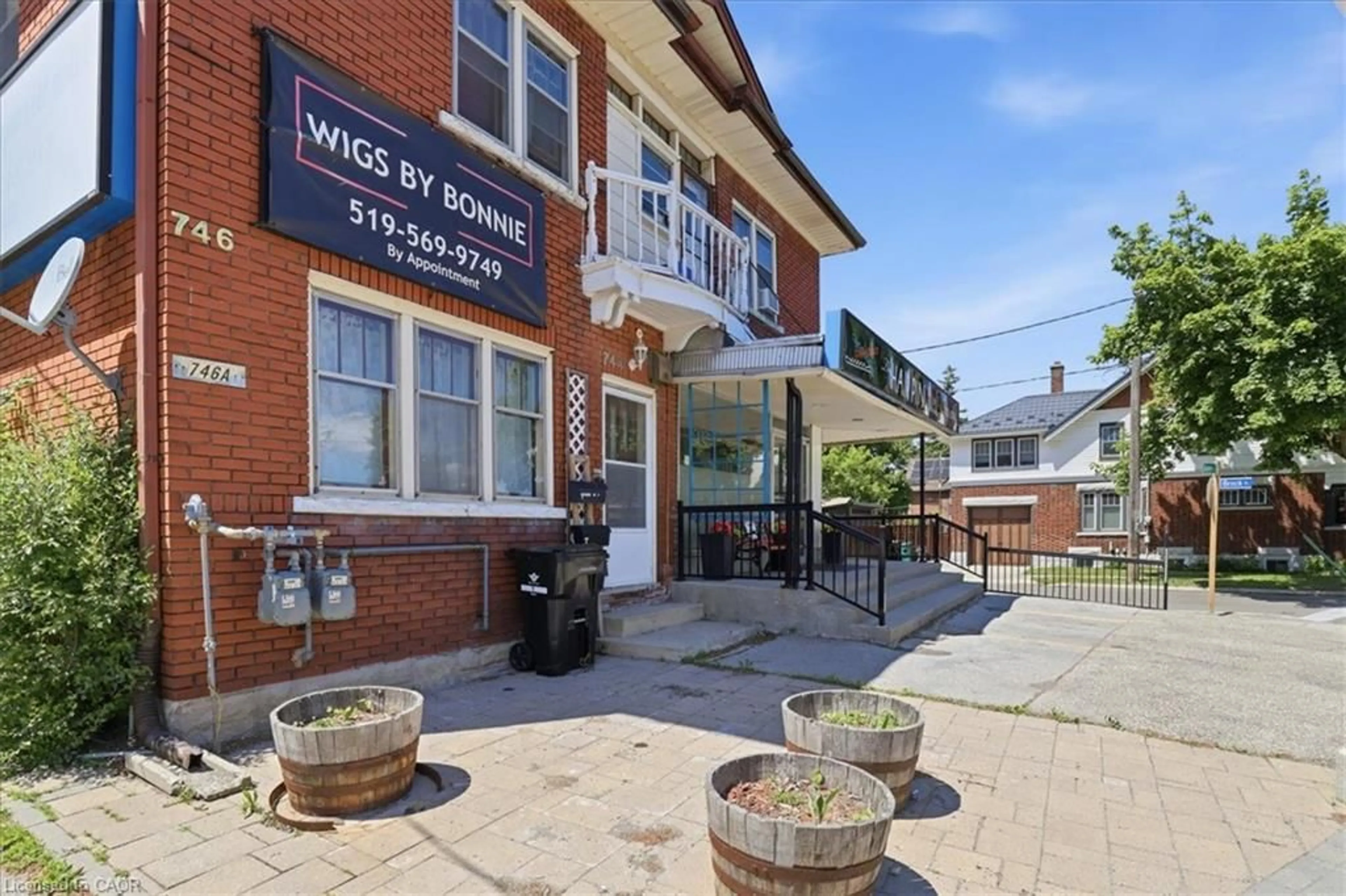A pic from outside/outdoor area/front of a property/back of a property/a pic from drone, street for 744 Queen St, Kitchener Ontario N2M 1A4