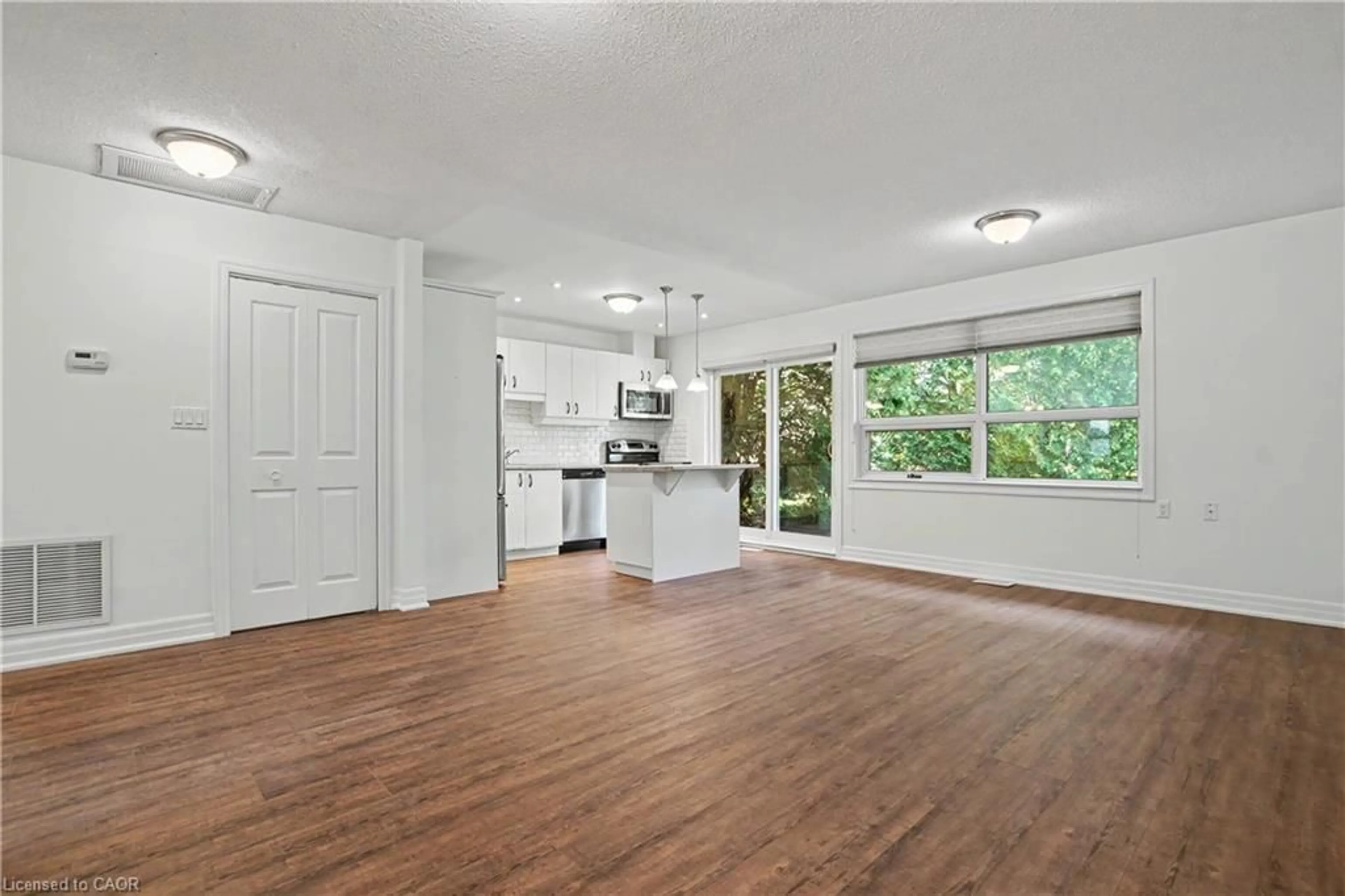 Open concept kitchen, wood/laminate floor for 5 Szollosy Cir, Hamilton Ontario L9B 1T8
