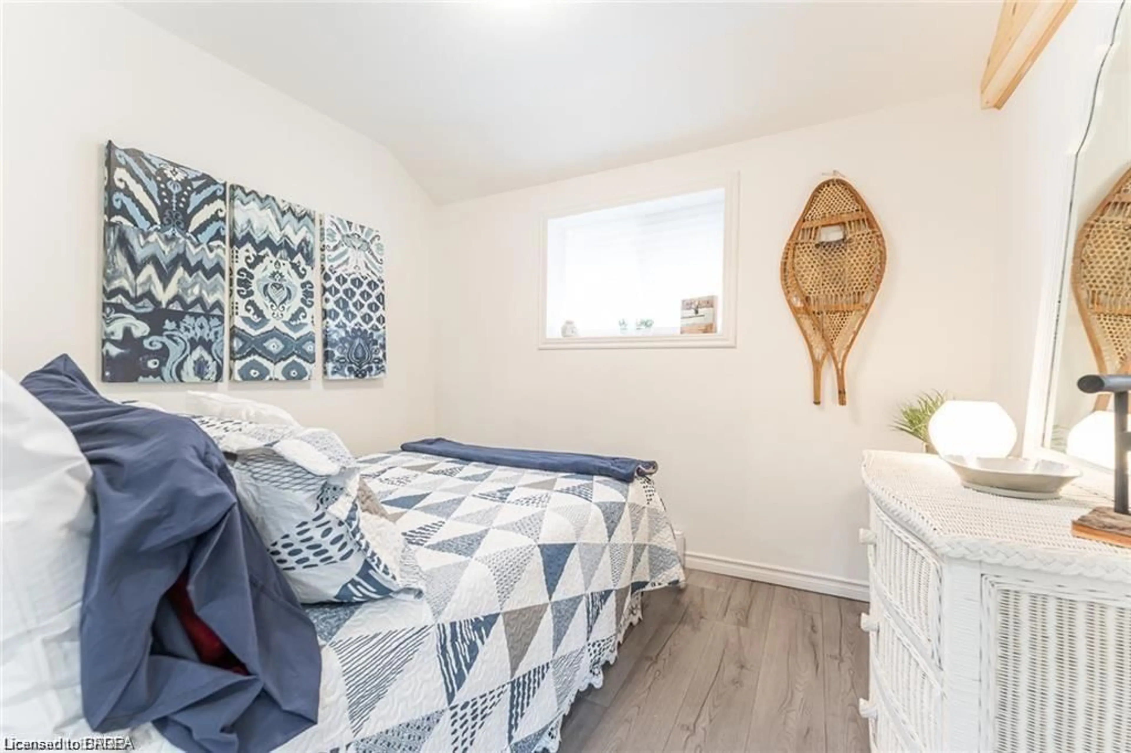 Bedroom with bed, wood/laminate floor for 9296 Beachwood Rd, Collingwood Ontario L9Y 3Z1