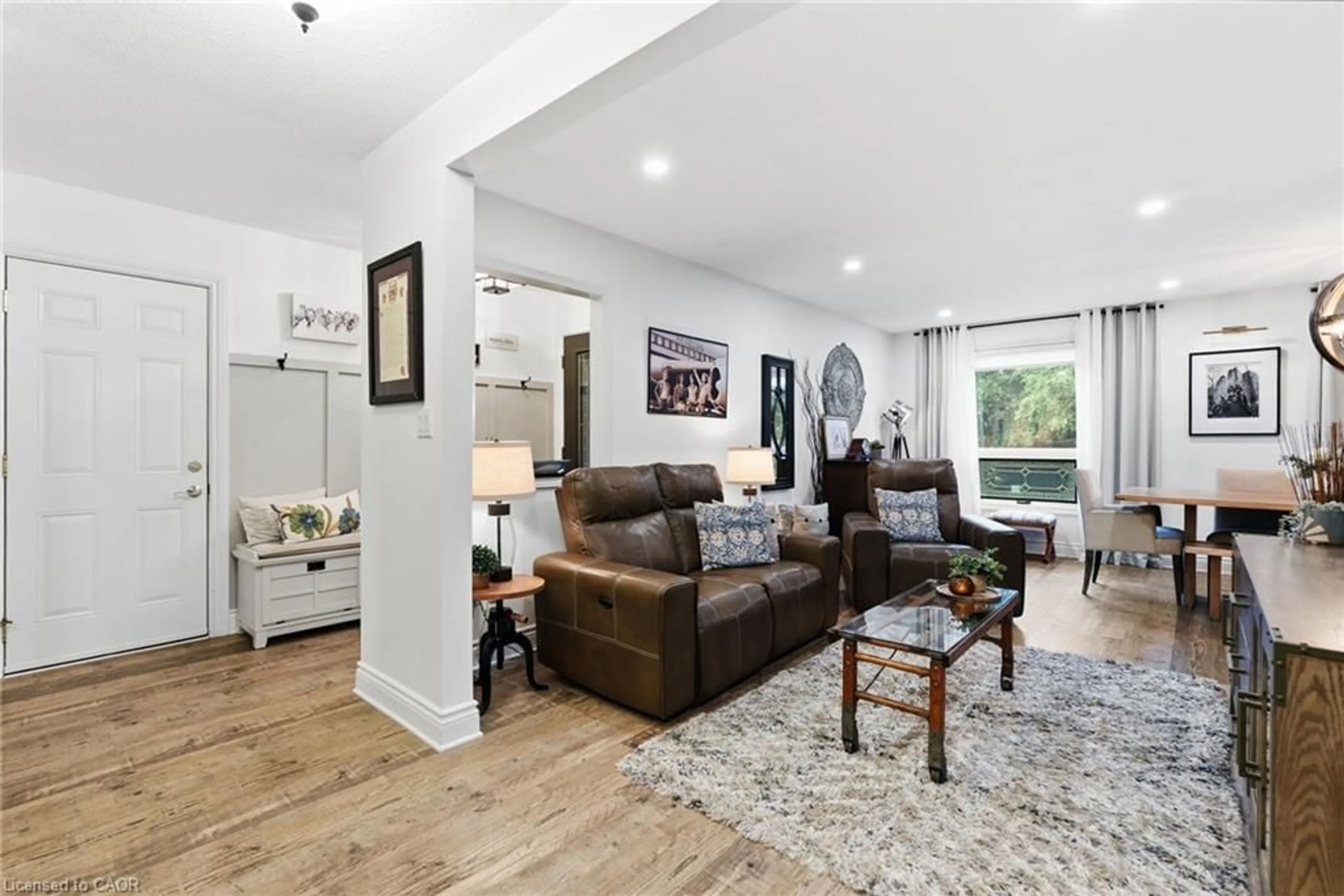 Living room with furniture, wood/laminate floor for 224 Athenia Dr, Stoney Creek Ontario L8J 1T7
