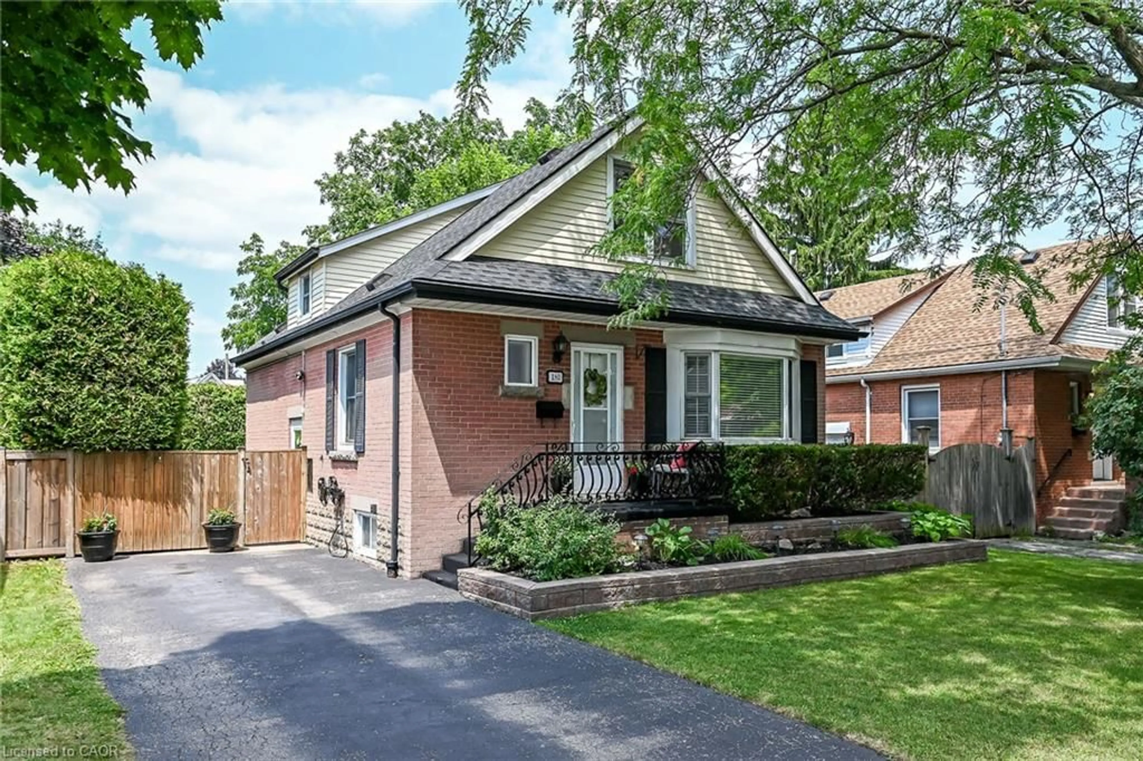 Home with brick exterior material, street for 180 East 25th St, Hamilton Ontario L8V 3A5
