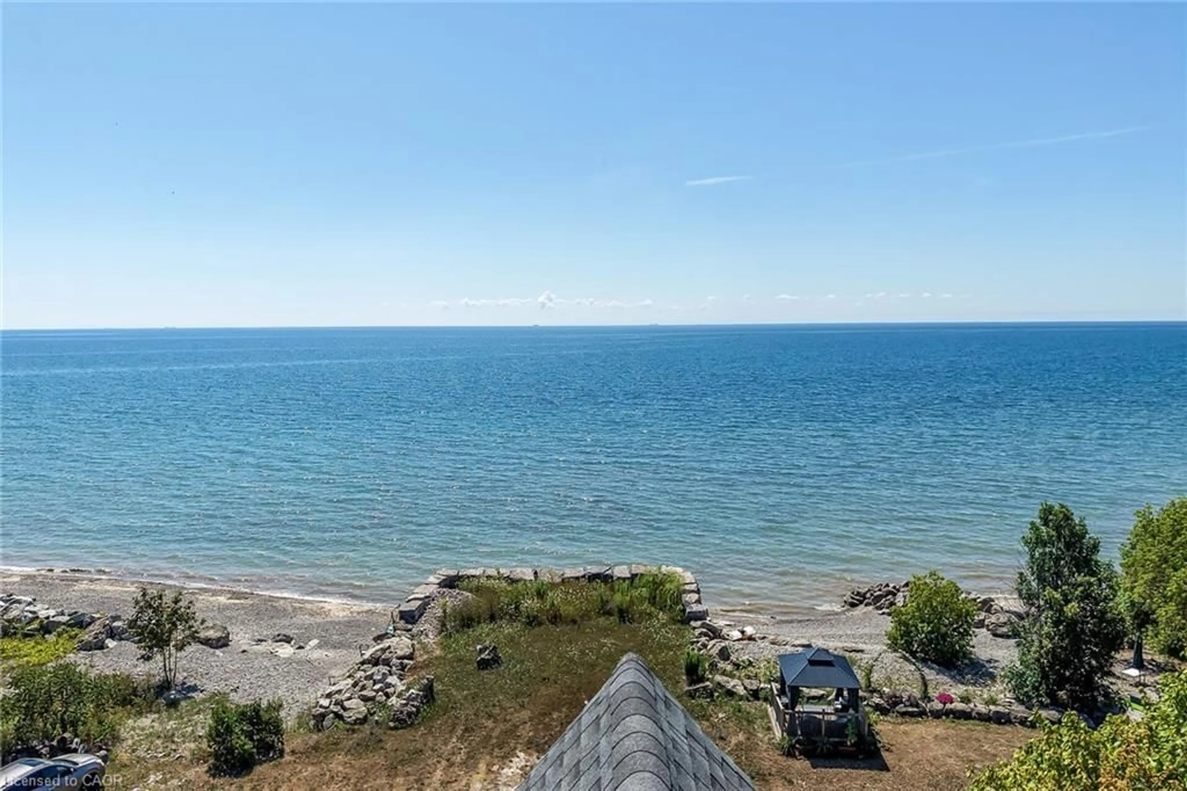 A pic from outside/outdoor area/front of a property/back of a property/a pic from drone, water/lake/river/ocean view for 2687 North Shore Dr, Lowbanks Ontario N0A 1K0