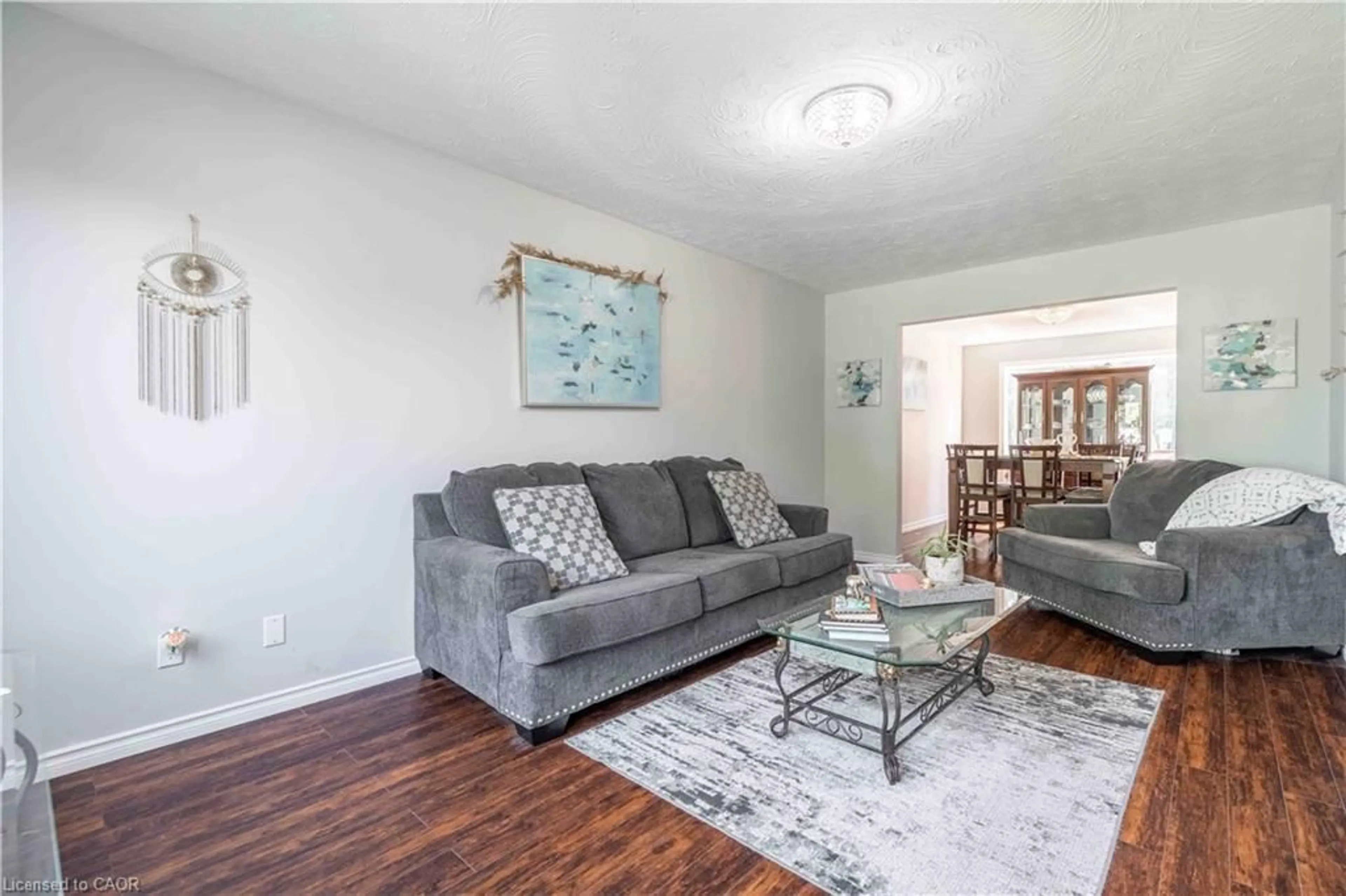 Living room with furniture, wood/laminate floor for 54 Selkirk St, Caledonia Ontario N3W 1J4