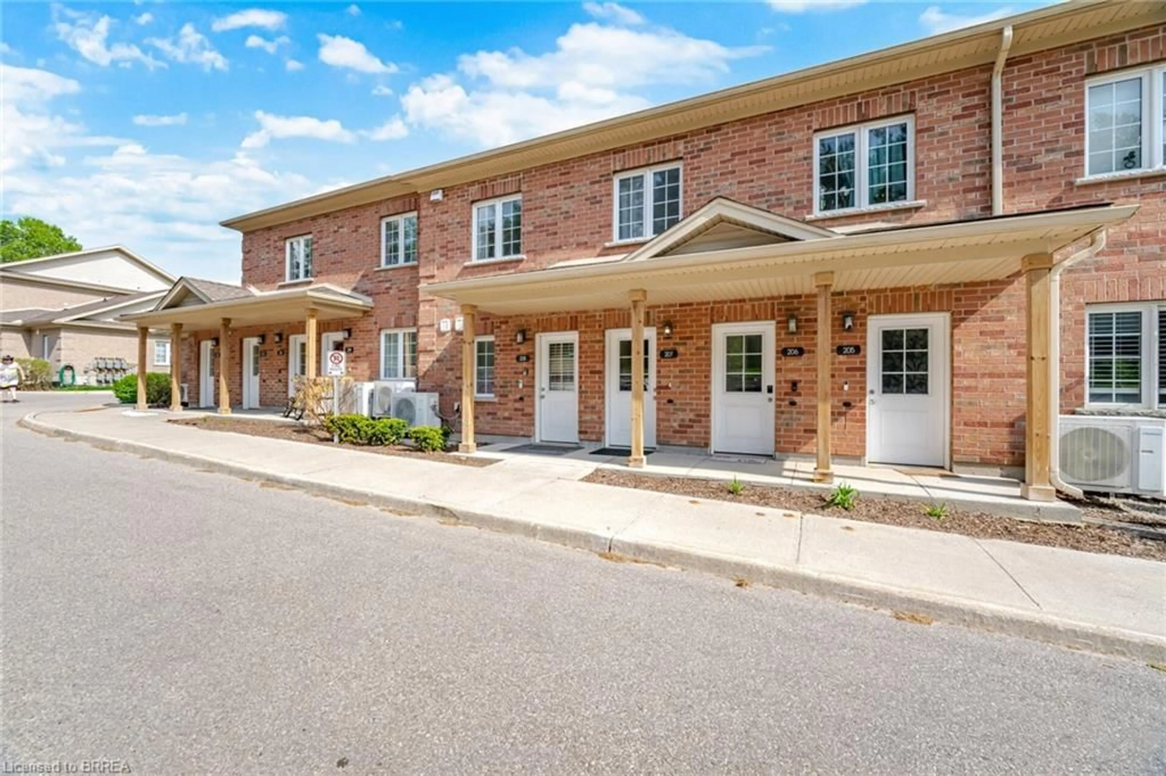 Home with brick exterior material, street for 7 Cityview Dr #207, Guelph Ontario N1E 0R1
