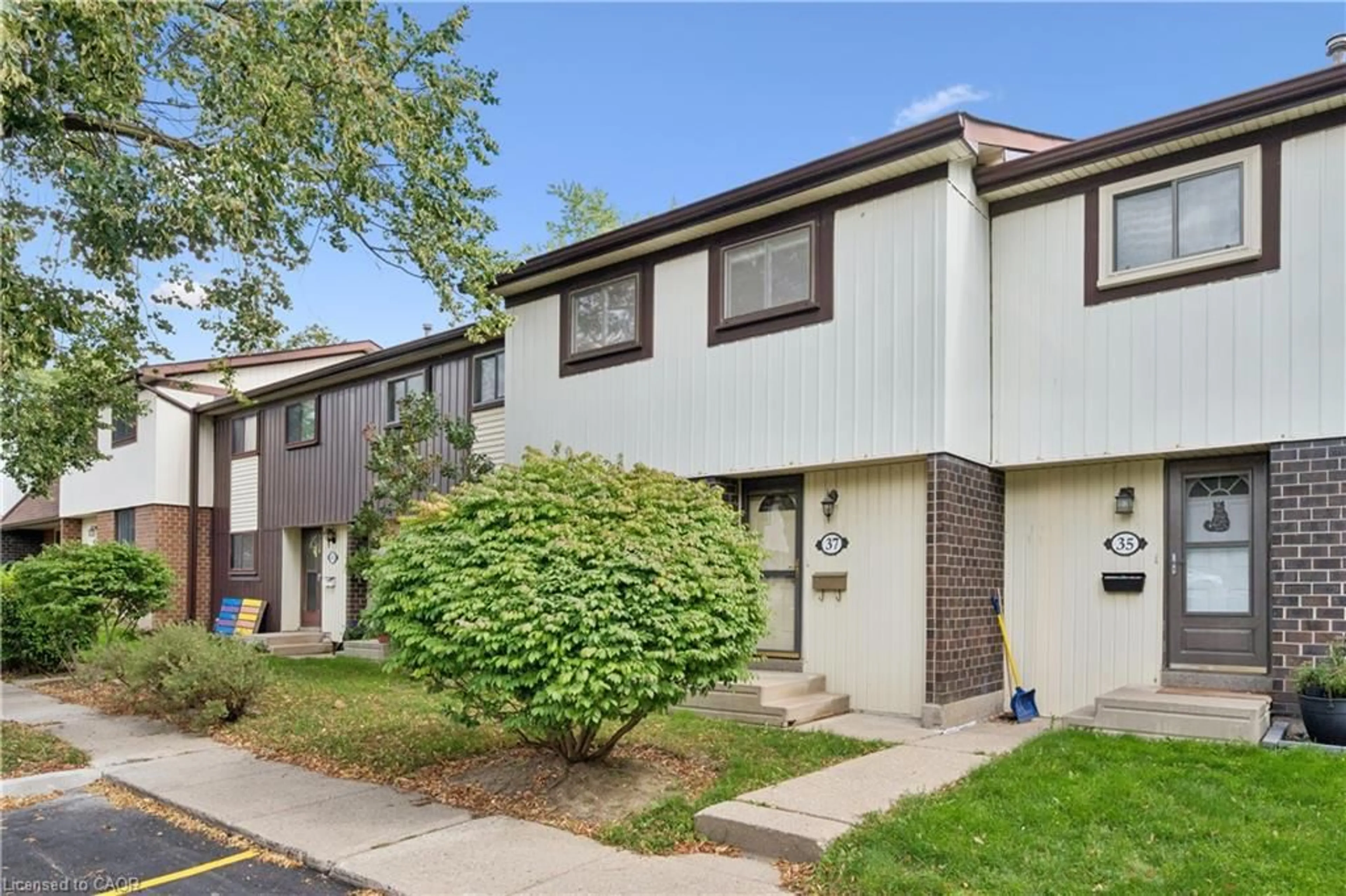 Home with vinyl exterior material, street for 45 Marksam Rd #37, Guelph Ontario N1H 6Y9