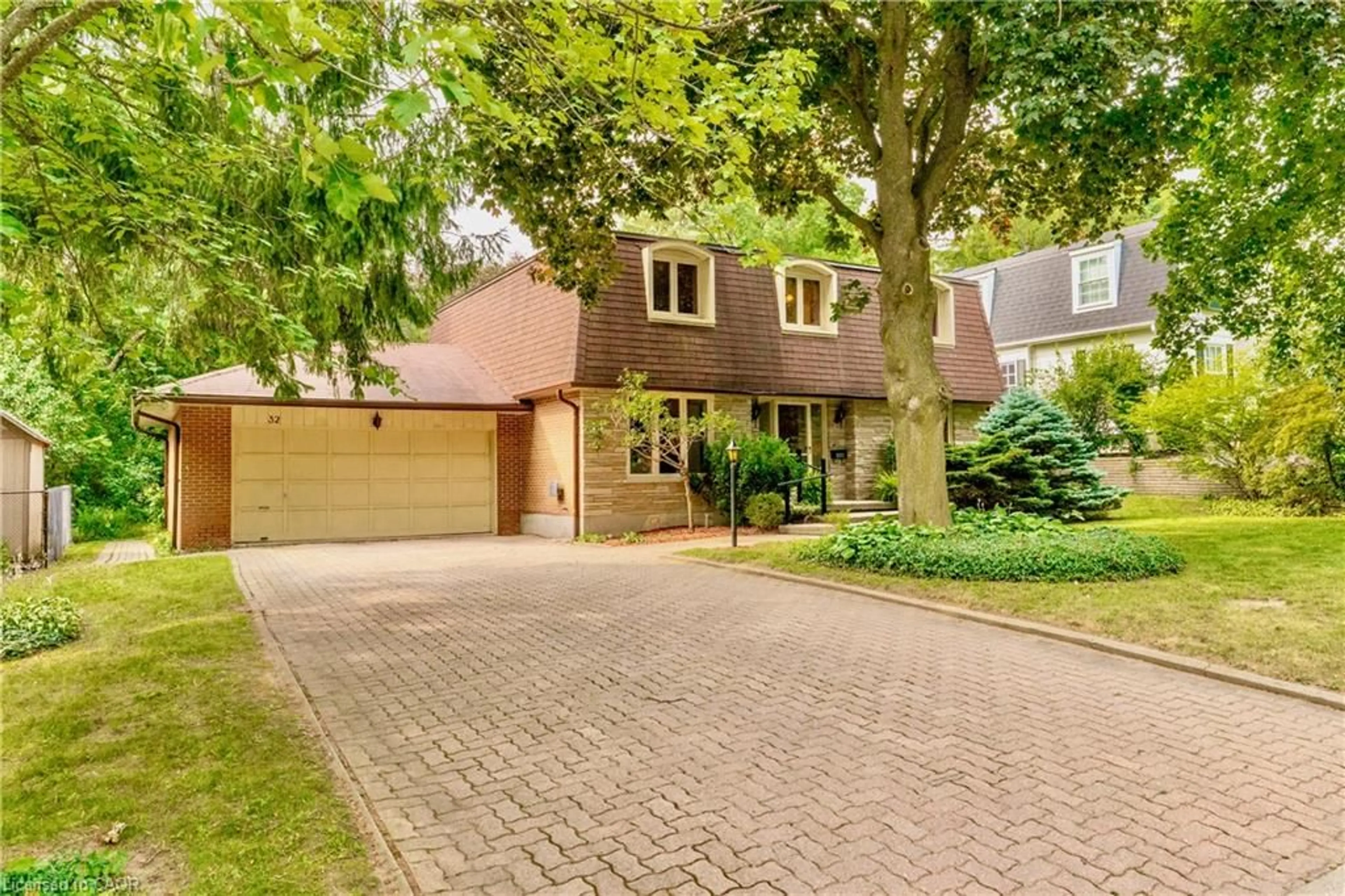 Home with brick exterior material, street for 32 Waverley Dr, Guelph Ontario N1E 6C8